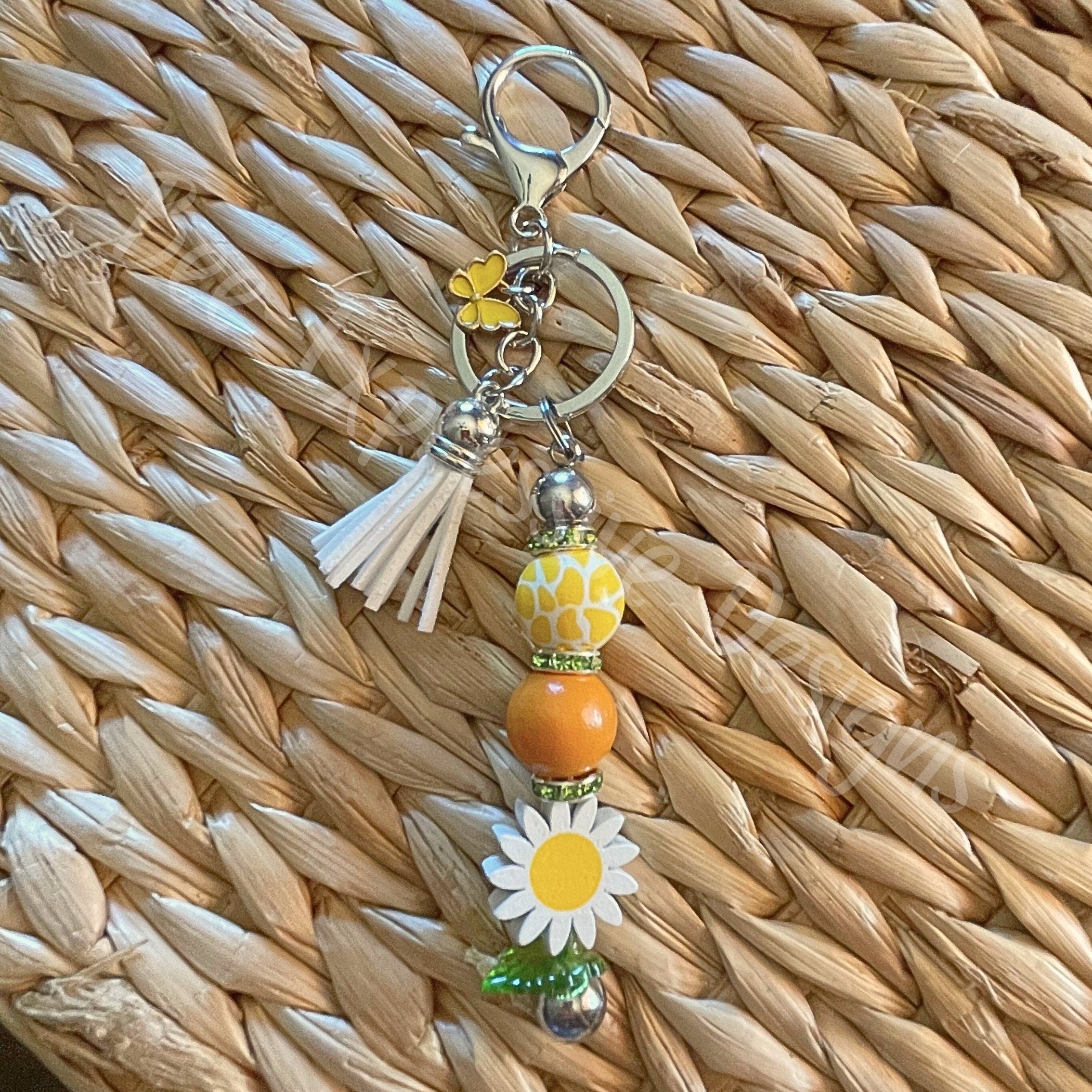 Handmade, wood daisy flower keychain! Interchangeable beaded bar, lobster clasp, tassel, & butterfly charm, acrylic leaf