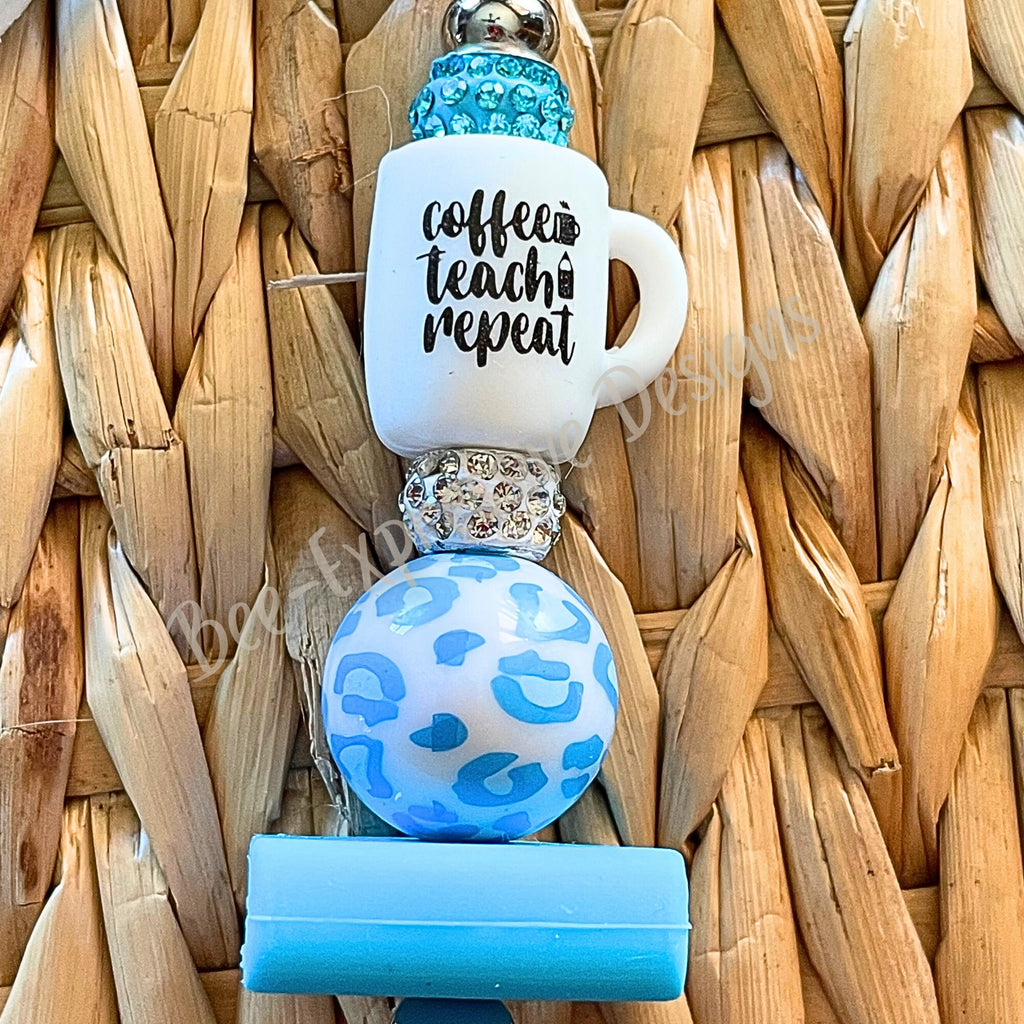 Adorable, handmade, TEACHER keychain with a book, daisy charm, tassel, & a silicone rubber focal cup bead that reads Coffee, Teach, Repeat!