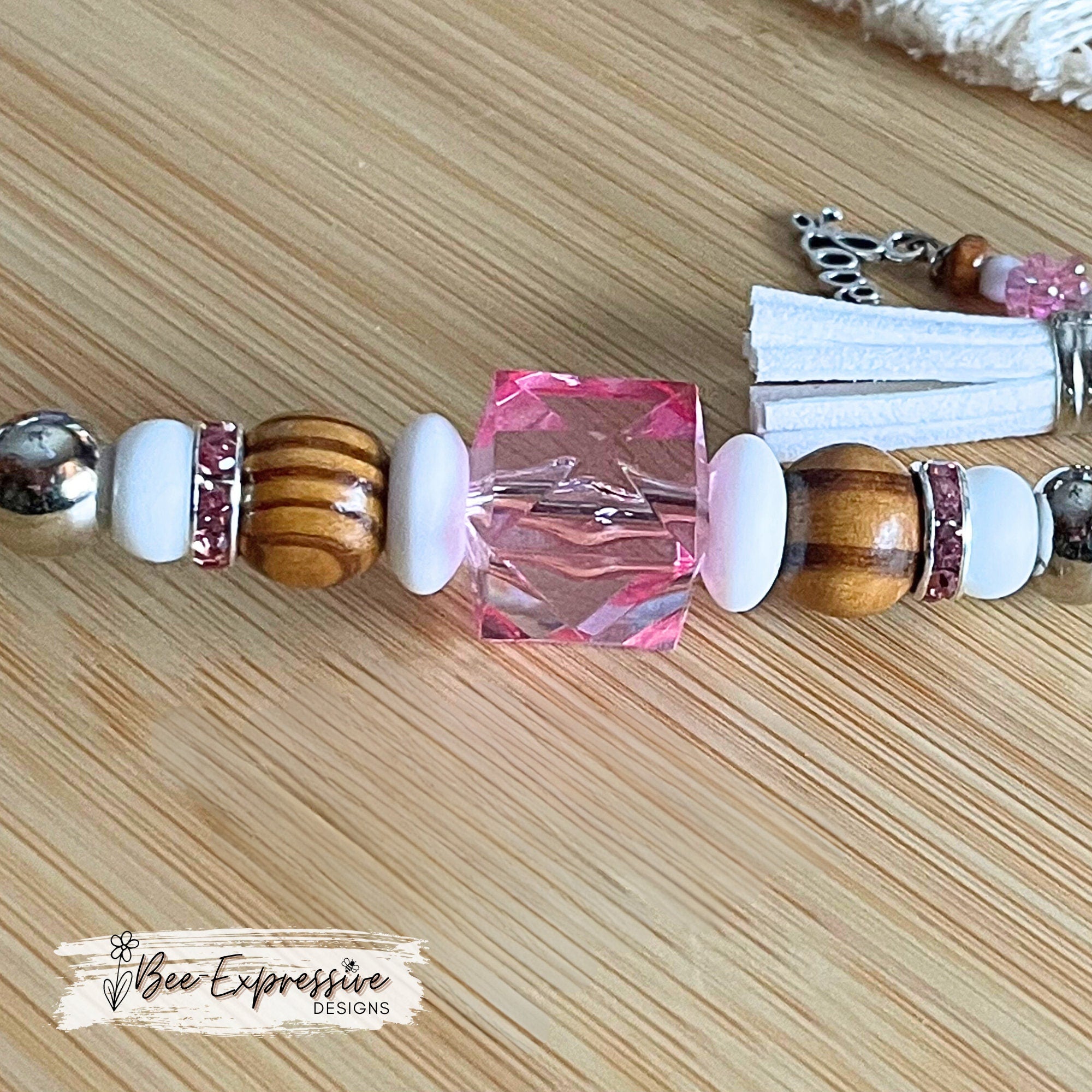 Beautiful, handmade keychain with wood, silicone, and rhinestone beads!  Lobster clasp, beaded tassel with LOVE charm & tiny pink flowers!