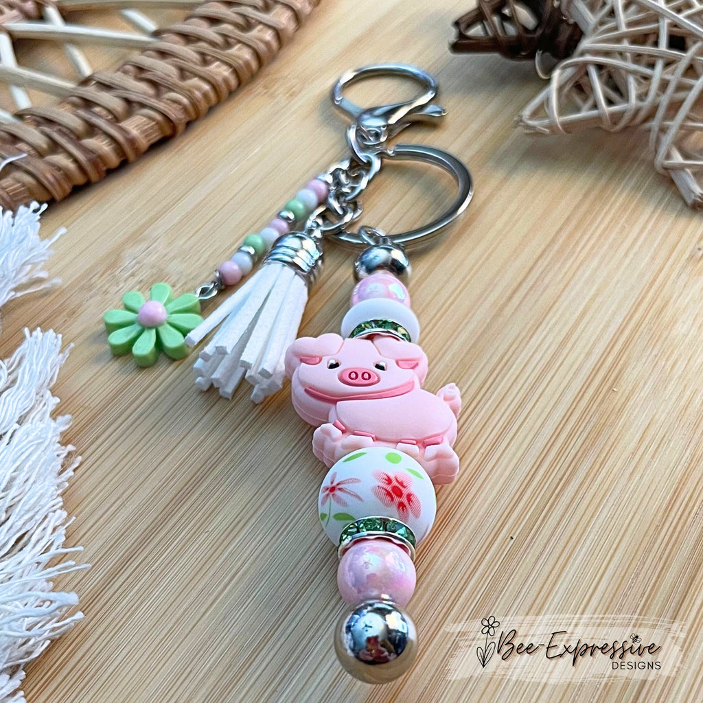 Handmade, beaded, PINK PIG metal keychain! Lobster or swivel clasp, iridescent and silicone beads, rhinestones, beaded tassel, a daisy charm