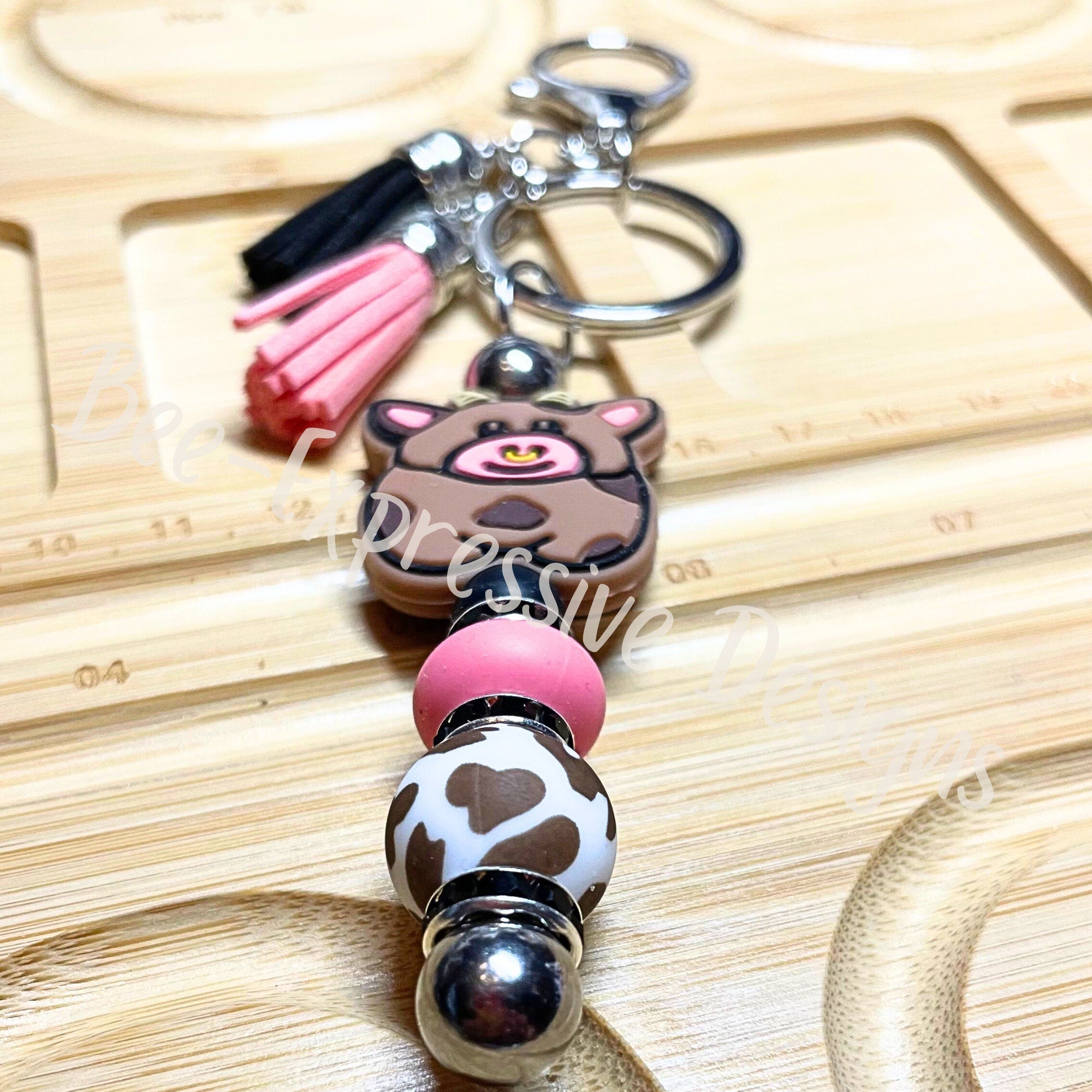 Handmade, beaded, BULL keychain! Lobster or swivel clasp, keyring, pink lentil, black rhinestones, brown cow print silicone bead, tassels!