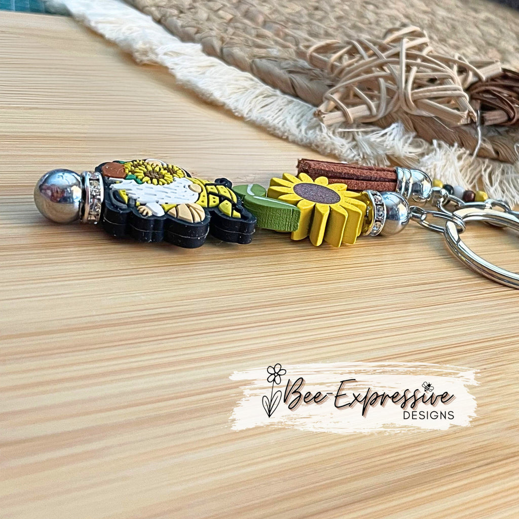 Handmade, unique, wooden sunflower gnome ' keychain!  Includes a beaded tassel and a bee charm!
