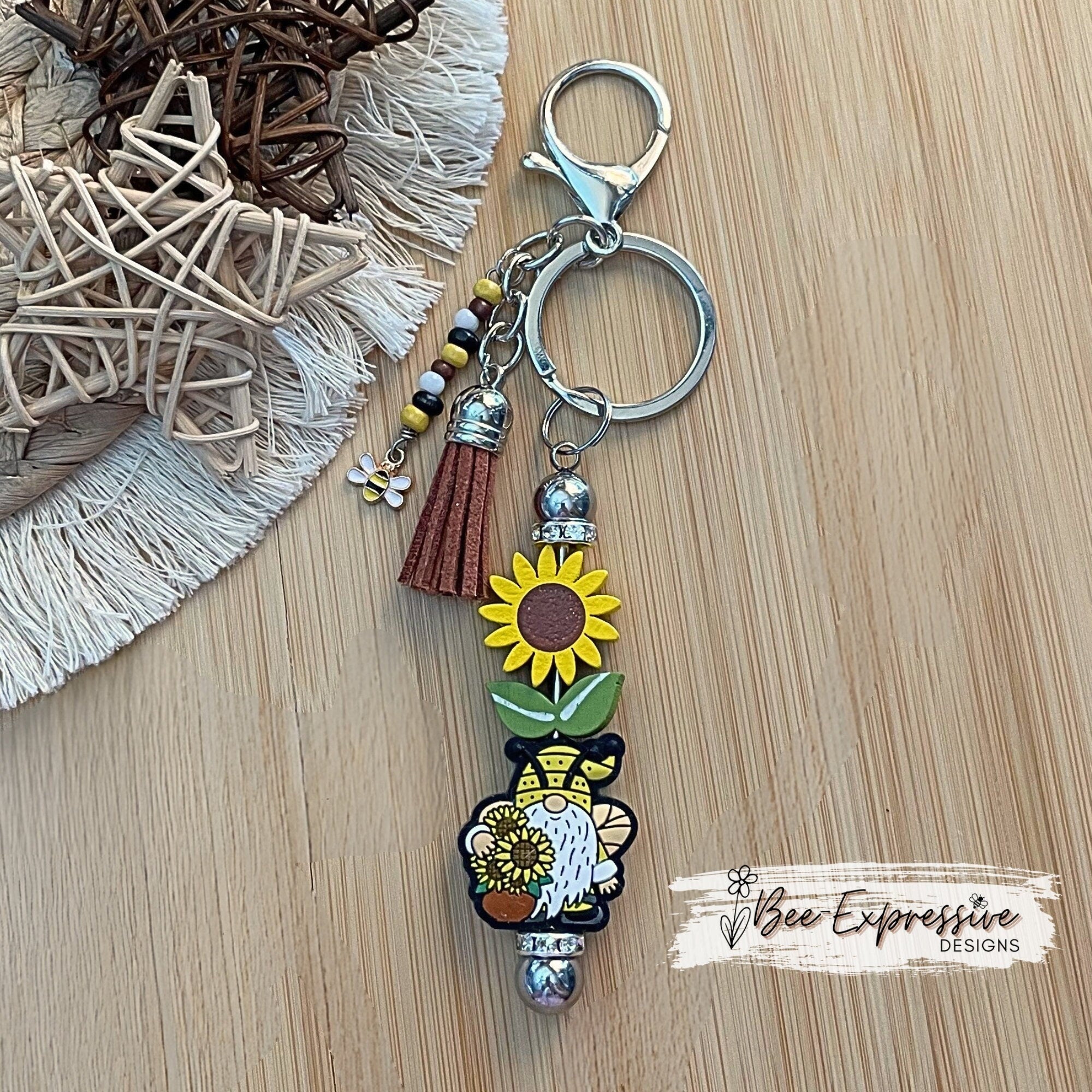 Handmade, wood sunflower bead, and silicone gnome keychain!  Includes a beaded tassel and a bee charm!