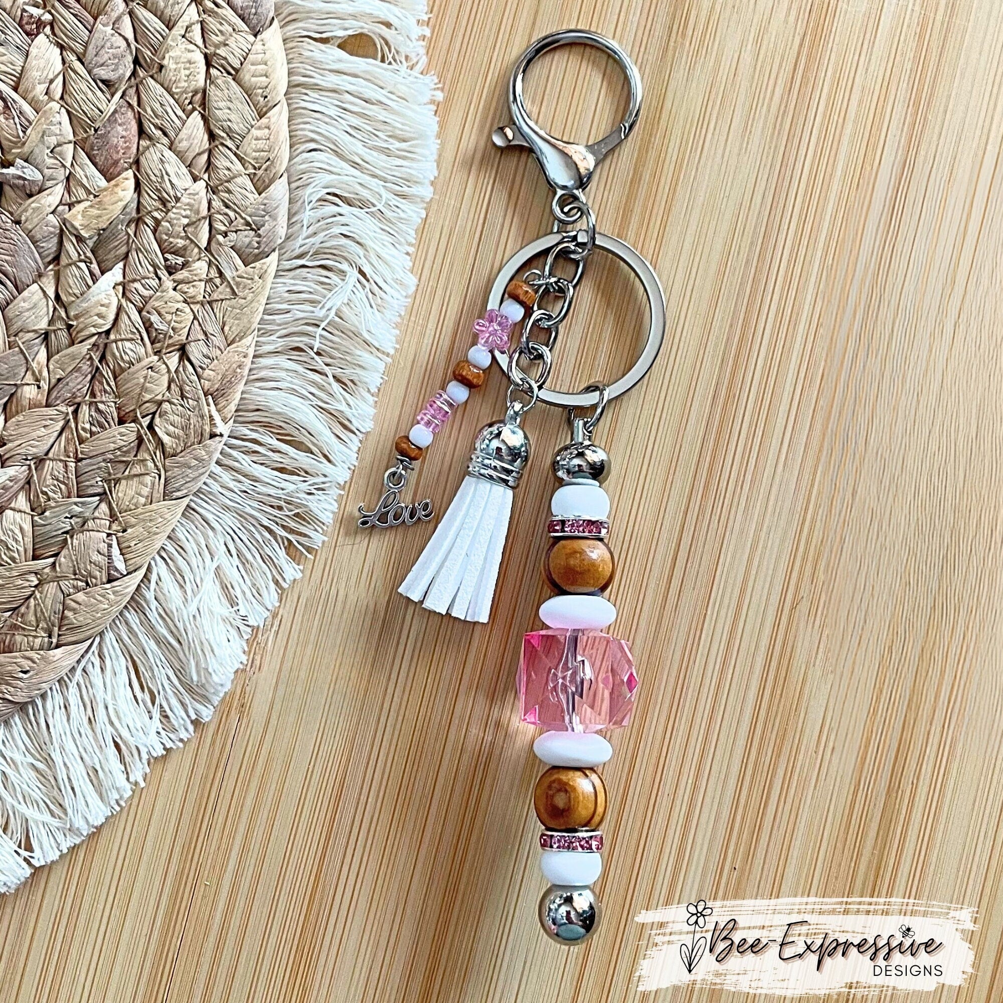 Beautiful, handmade keychain with wood, silicone, and rhinestone beads!  Lobster clasp, beaded tassel with LOVE charm & tiny pink flowers!