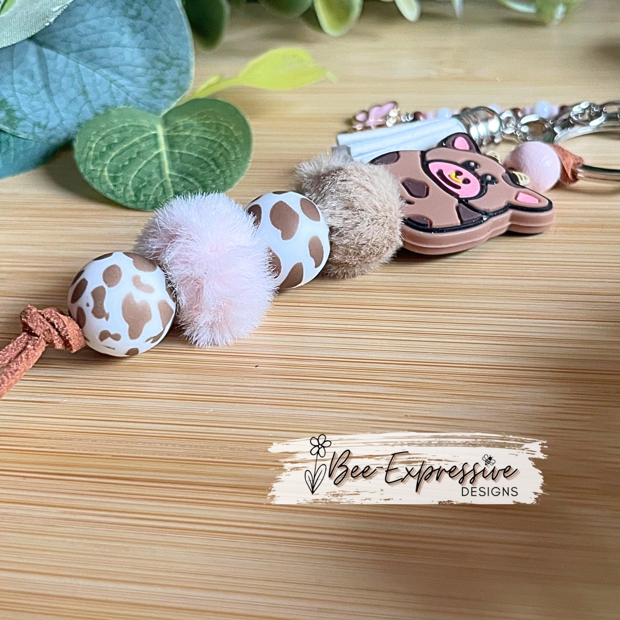 Beaded, COW keychain! Lobster or swivel clasp, furry beads, animal print silicone beads, acrylic beaded tassel with pink butterfly charm!