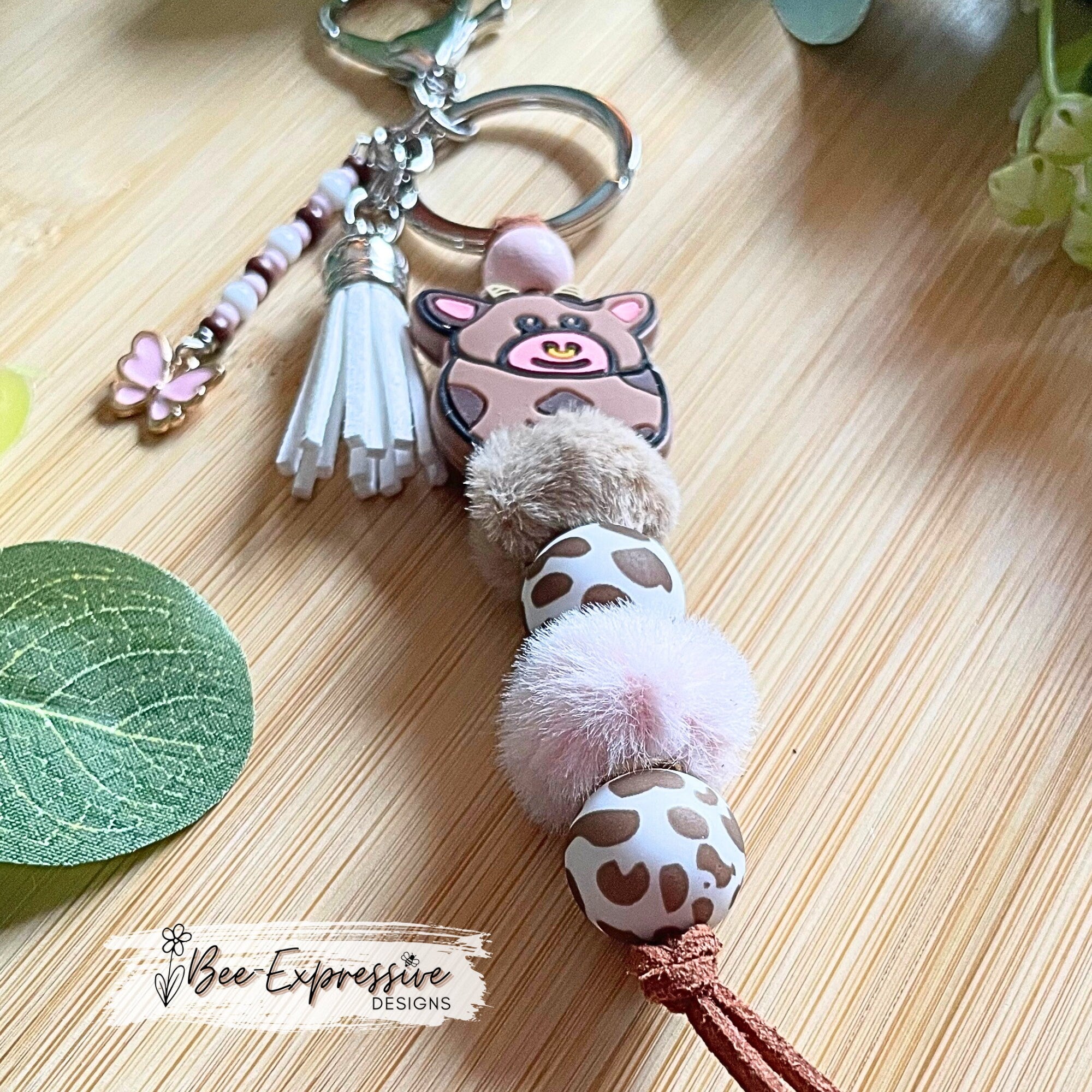 Beaded, COW keychain! Lobster or swivel clasp, furry beads, animal print silicone beads, acrylic beaded tassel with pink butterfly charm!