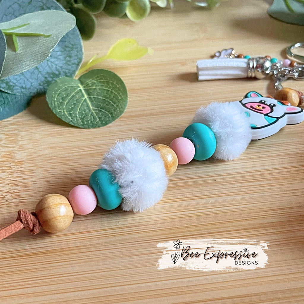 Adorable, handmade, bull cow keychain! Turquoise silicone lentil beads, wood beads, silicone round pink beads, beaded tassel with butterfly
