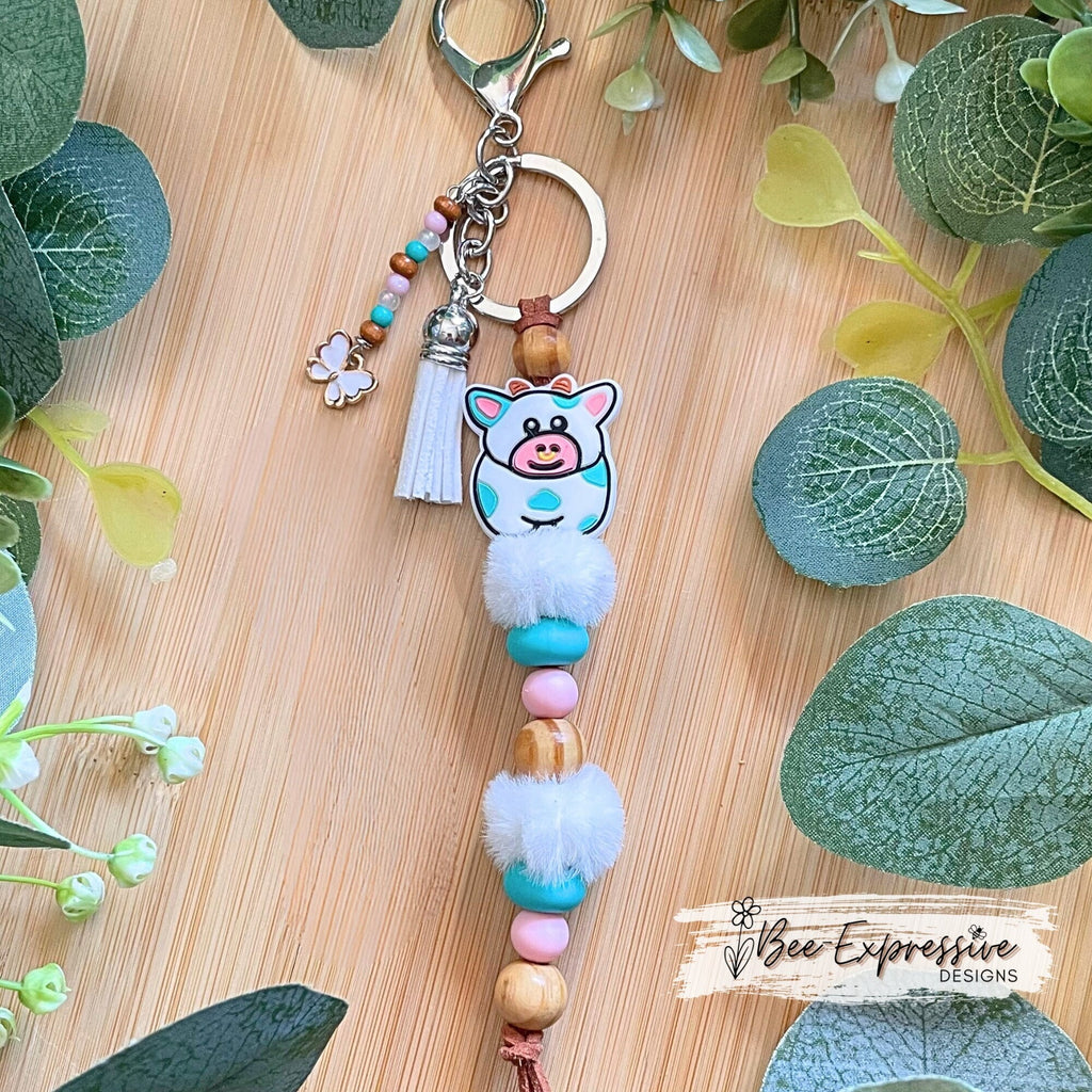 Adorable, handmade, bull cow keychain! Turquoise silicone lentil beads, wood beads, silicone round pink beads, beaded tassel with butterfly