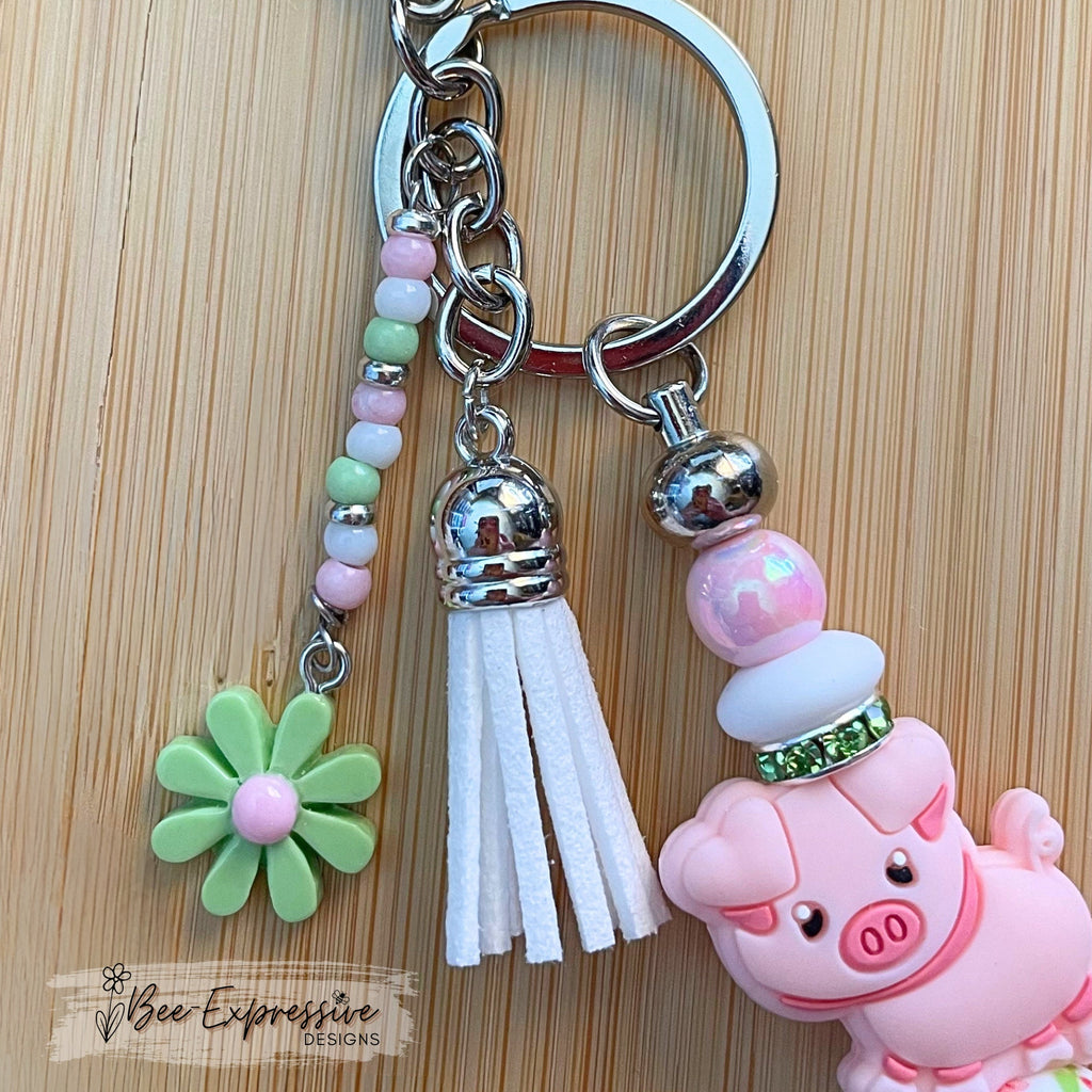Handmade, beaded, PINK PIG metal keychain! Lobster or swivel clasp, iridescent and silicone beads, rhinestones, beaded tassel, a daisy charm