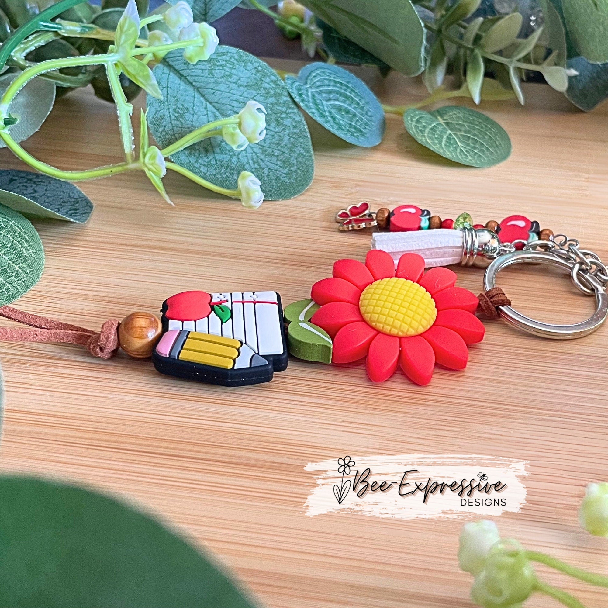 Handmade, cute, TEACHER keychain!  Lobster claw clasp, brown suede cord, daisy focal bead, beaded tassel, clay apple beads, butterfly charm