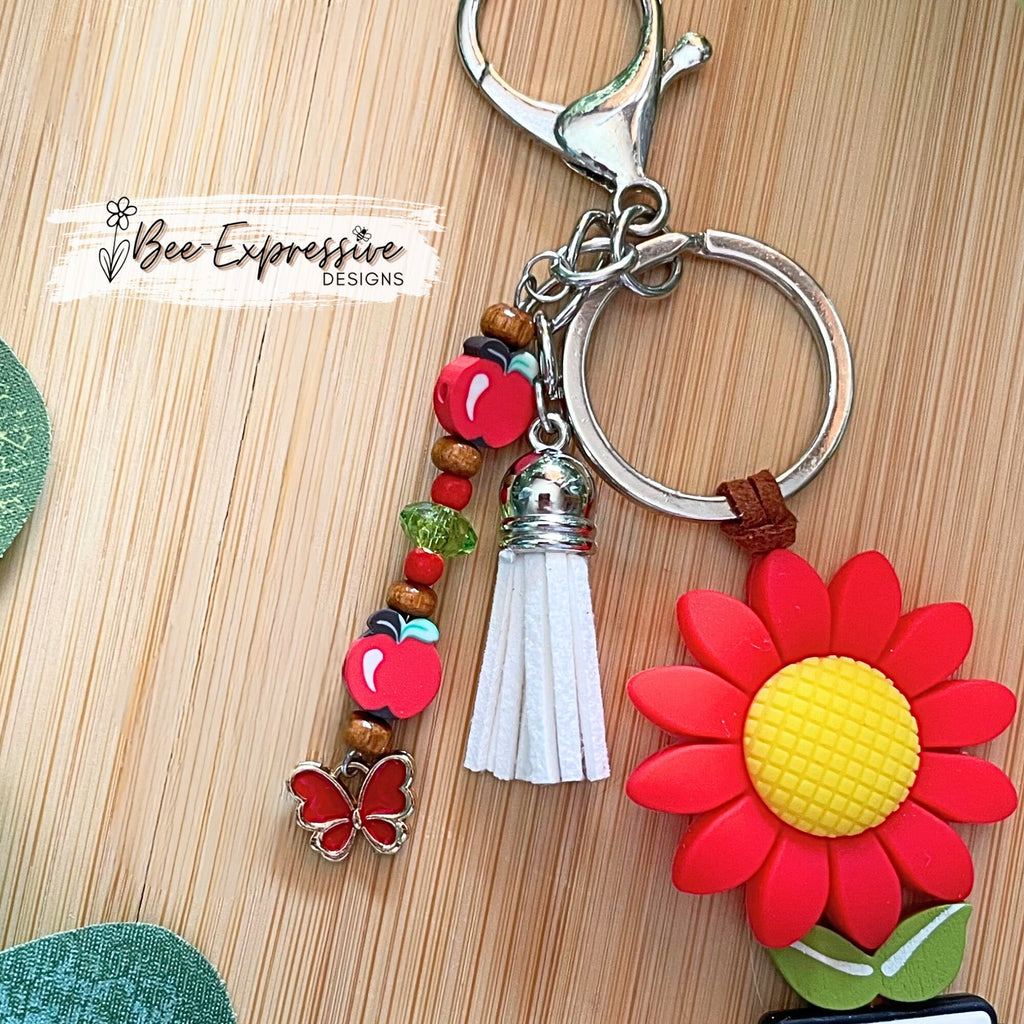 Handmade, cute, TEACHER keychain!  Lobster claw clasp, brown suede cord, daisy focal bead, beaded tassel, clay apple beads, butterfly charm