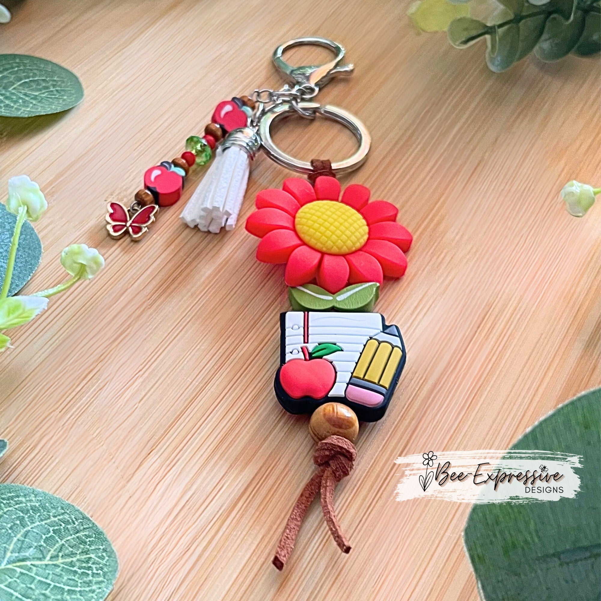 Handmade, cute, TEACHER keychain!  Lobster claw clasp, brown suede cord, daisy focal bead, beaded tassel, clay apple beads, butterfly charm