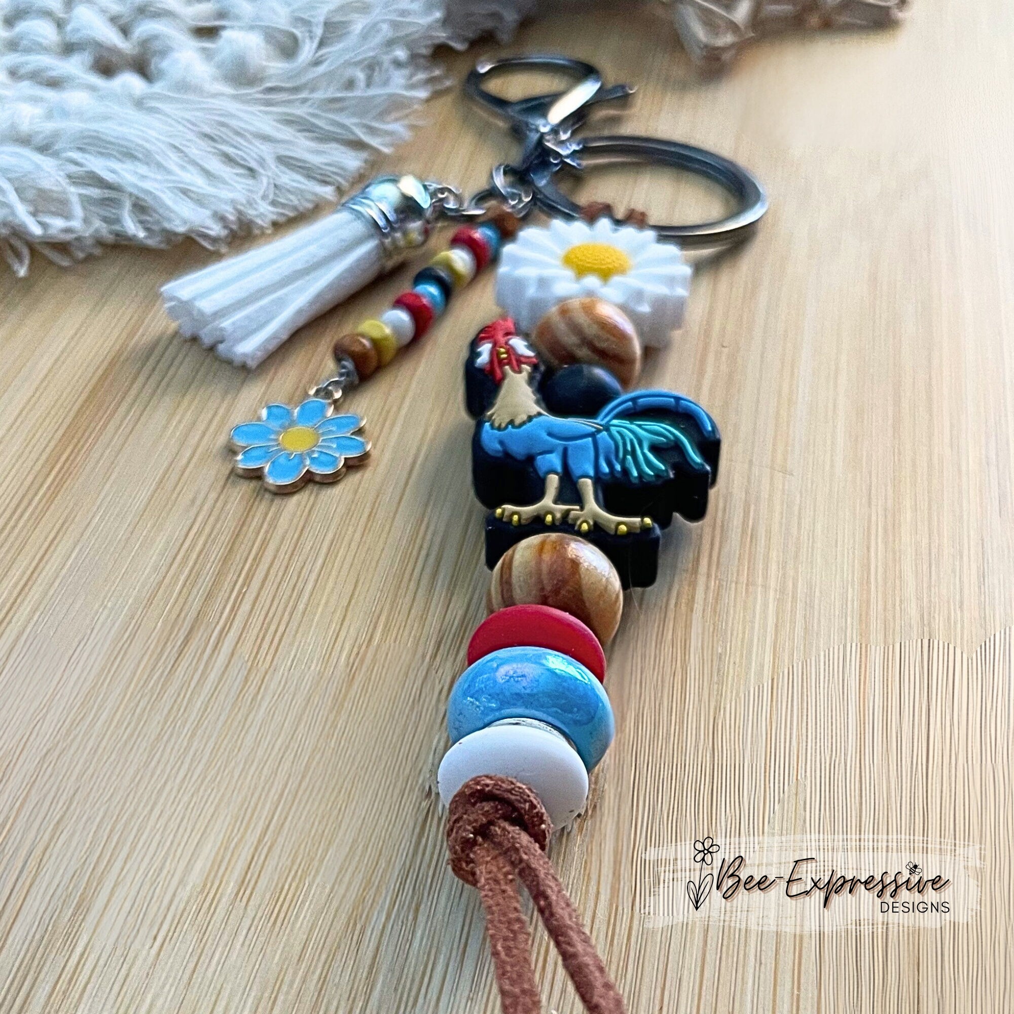 Adorable| vividly colored| handmade| silicone chicken| silicone rooster keychain| daisy flowers| beaded tassel| lobster clasp| nylon cord|