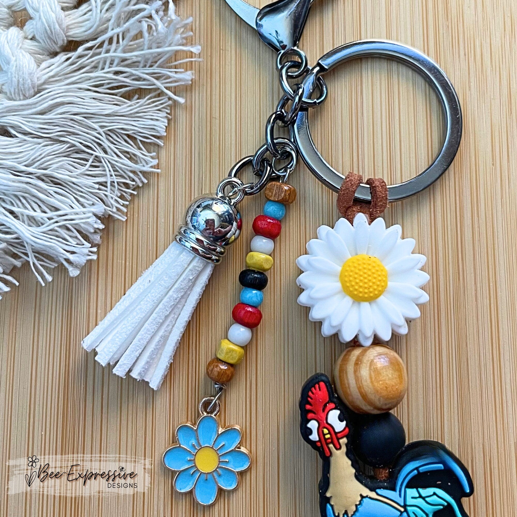 Adorable| vividly colored| handmade| silicone chicken| silicone rooster keychain| daisy flowers| beaded tassel| lobster clasp| nylon cord|
