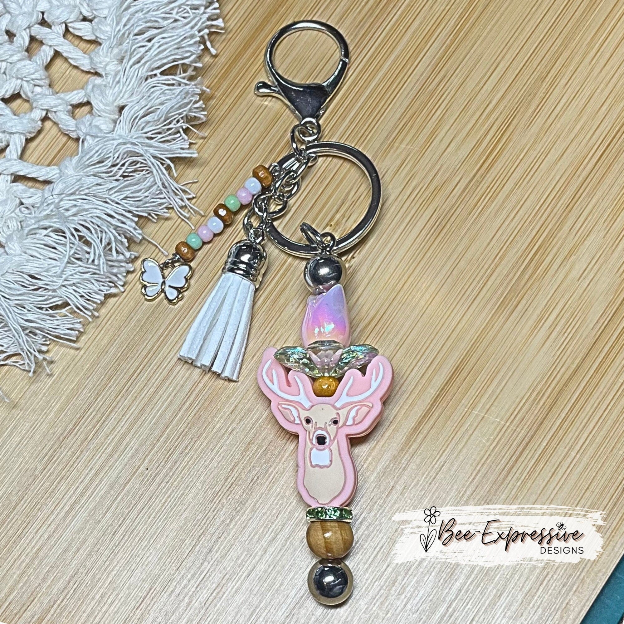Beautiful and unique, a metal interchangeable DEER keychain!  Acrylic tulip with leaf bed, wood beads, beaded tassel, butterfly charm