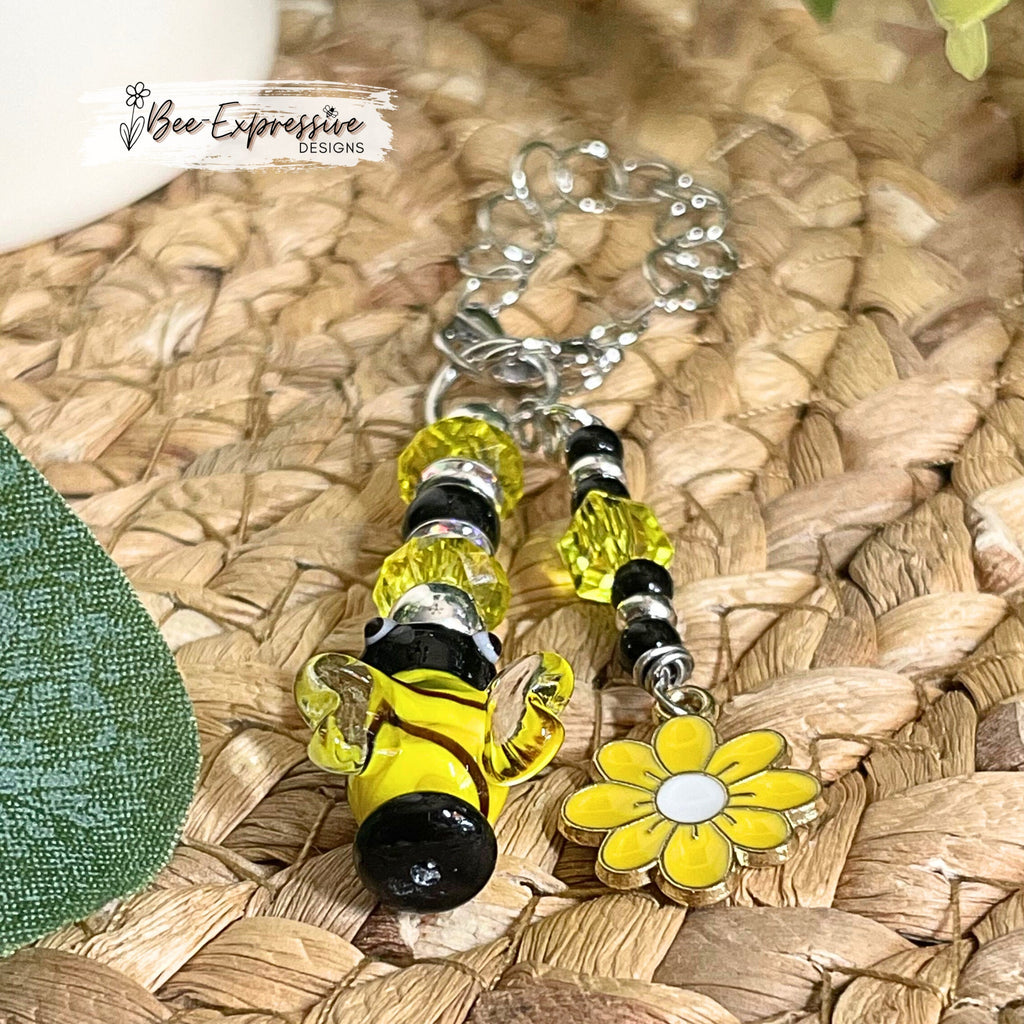 Handmade and fun, tumbler glass bumble bee charm chain! Acrylic beads, rhinestone spacers, beaded tassel with daisy flower charm!