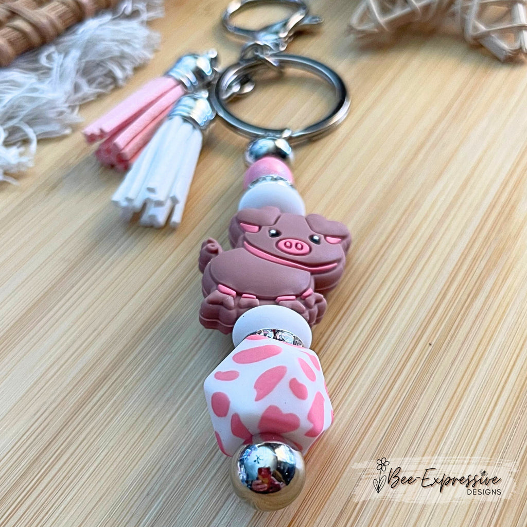 Pink PIG beaded keychain! Lobster or swivel clasp, bead bar, rhinestones, animal print octagon bead, lentils, and 2 tassels