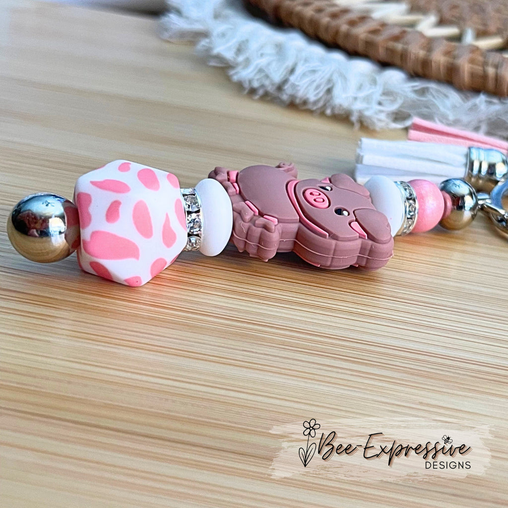 Pink PIG beaded keychain! Lobster or swivel clasp, bead bar, rhinestones, animal print octagon bead, lentils, and 2 tassels