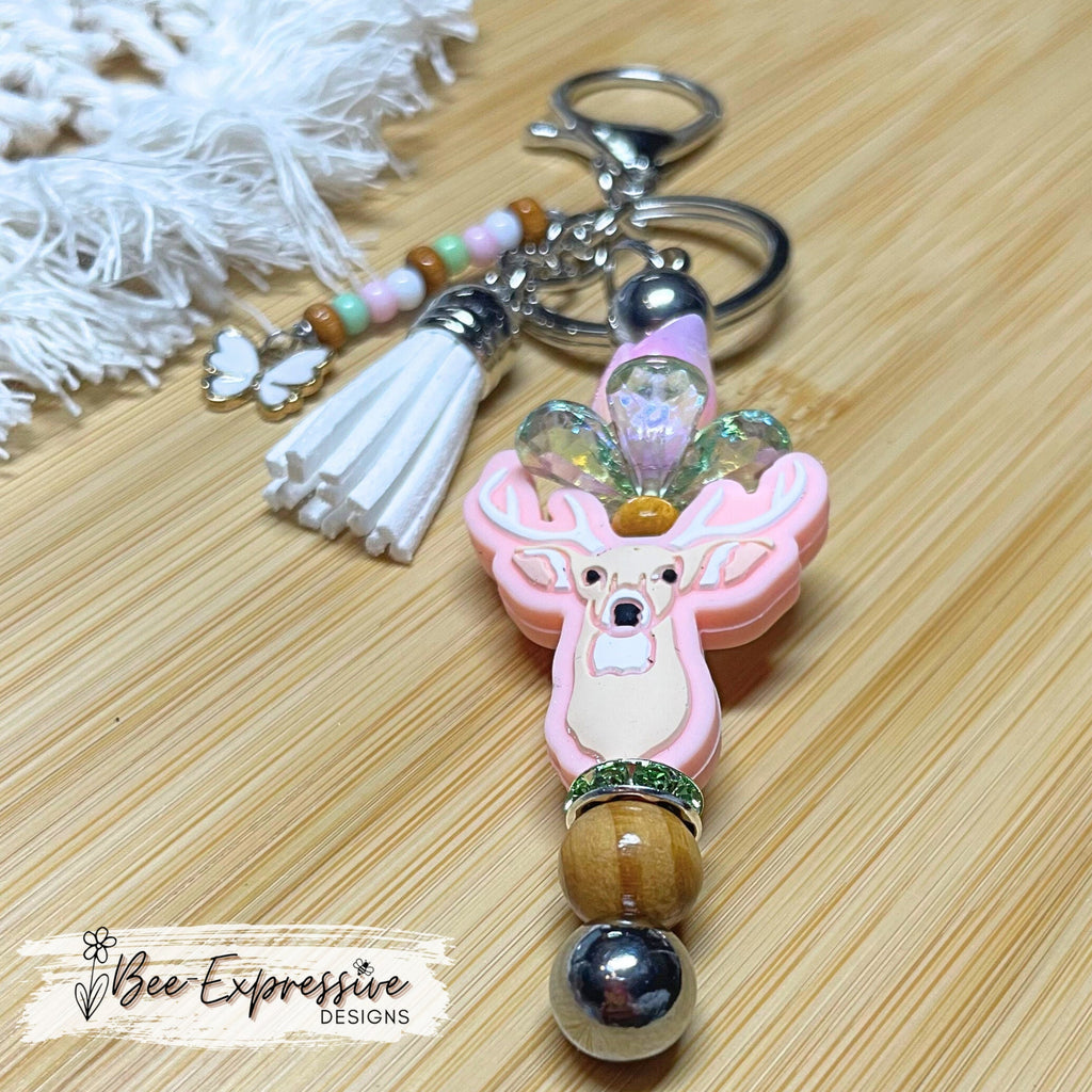 Beautiful and unique, a metal interchangeable DEER keychain!  Acrylic tulip with leaf bed, wood beads, beaded tassel, butterfly charm