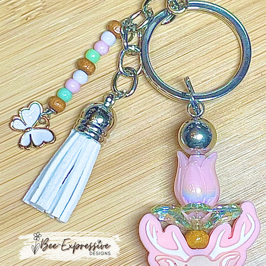 Beautiful and unique, a metal interchangeable DEER keychain!  Acrylic tulip with leaf bed, wood beads, beaded tassel, butterfly charm
