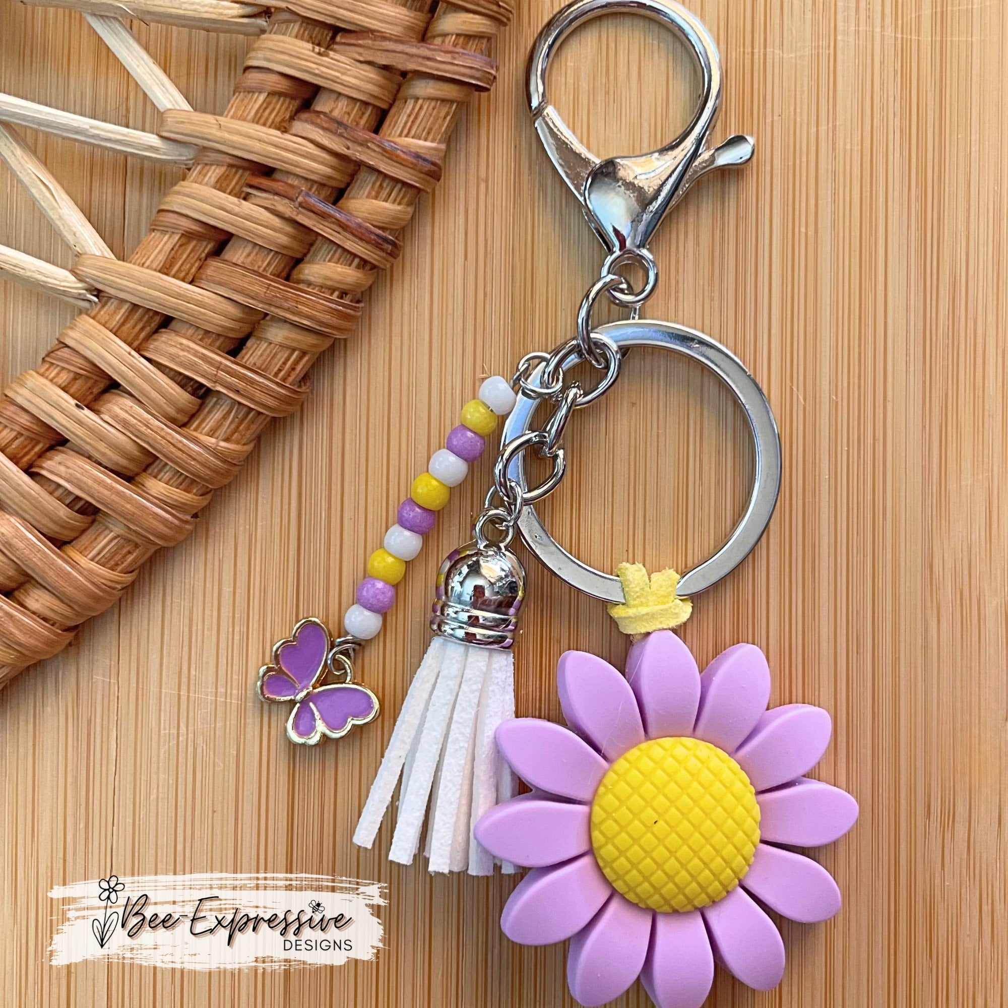 Beaded, purple COW keychain! Lobster or swivel clasp, silicone purple sunflower, yellow suede cord, beaded tassel with a butterfly charm!