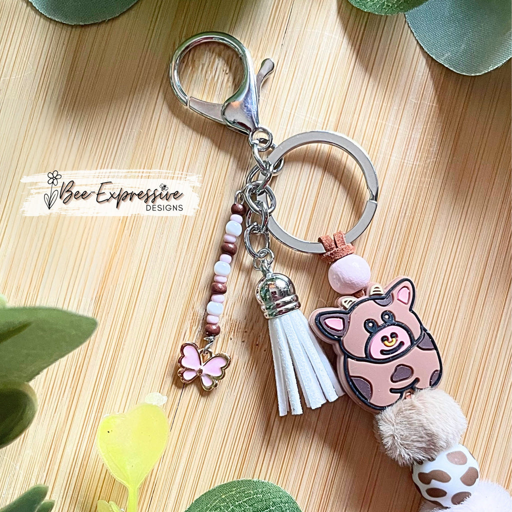 Beaded, COW keychain! Lobster or swivel clasp, furry beads, animal print silicone beads, acrylic beaded tassel with pink butterfly charm!