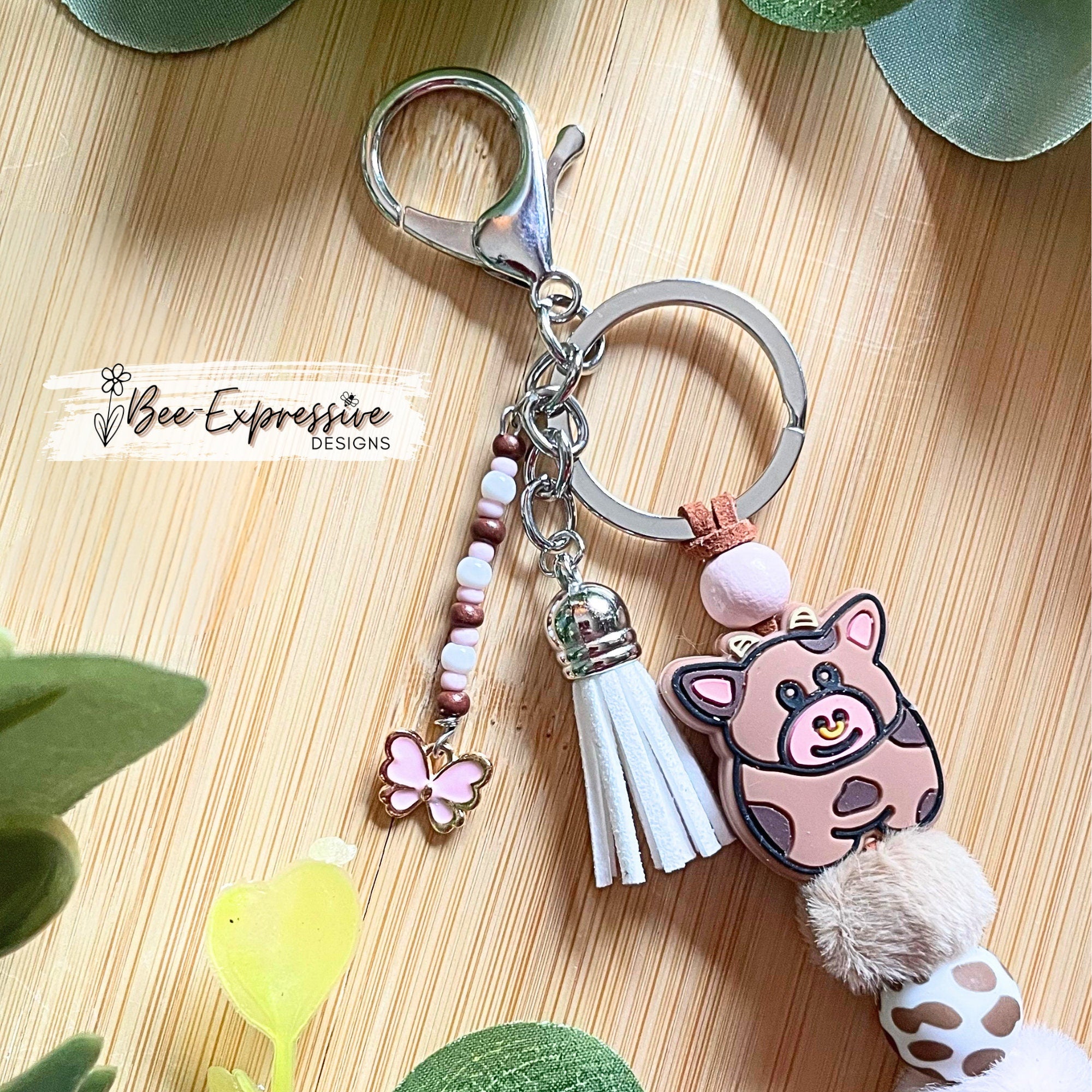 Beaded, COW keychain! Lobster or swivel clasp, furry beads, animal print silicone beads, acrylic beaded tassel with pink butterfly charm!