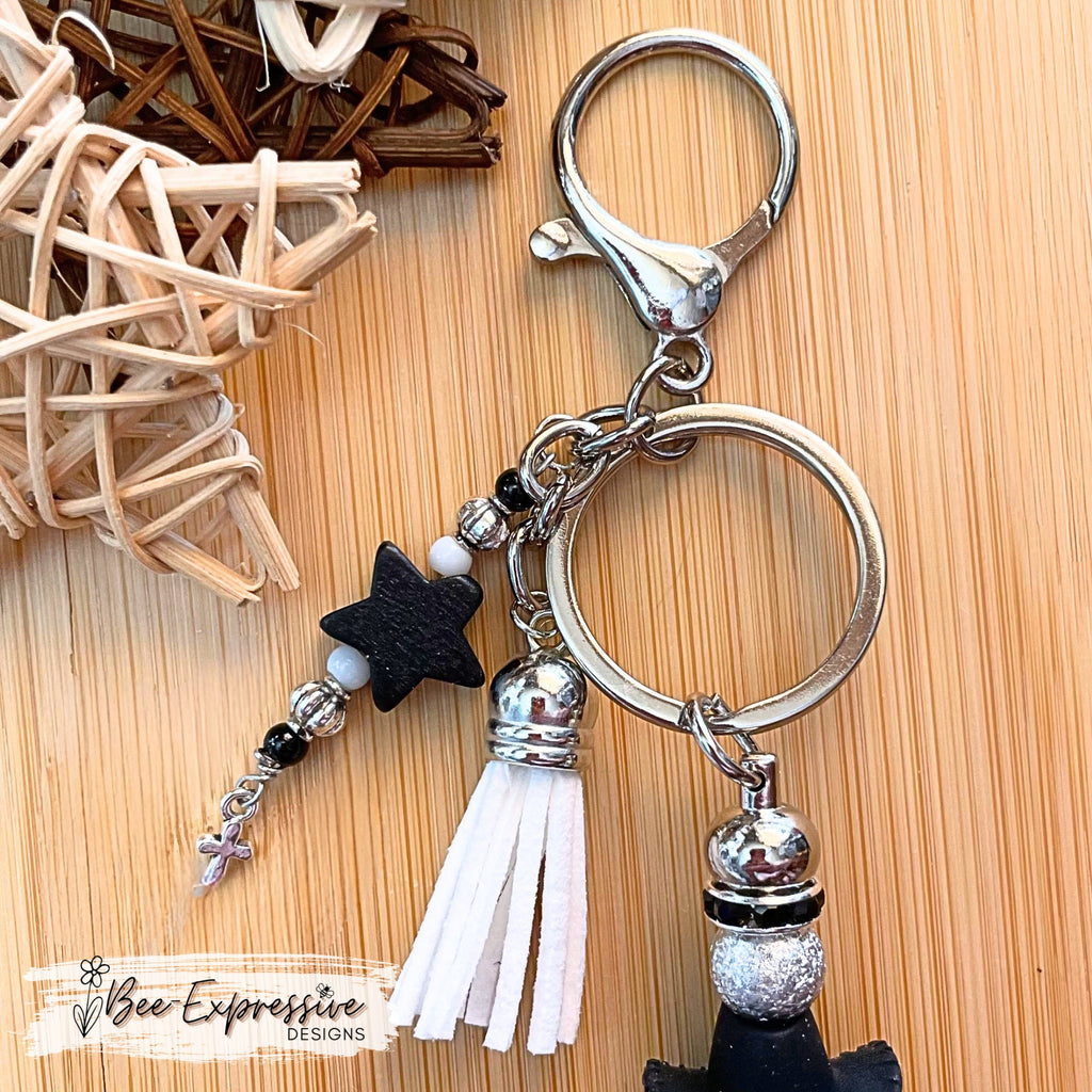 Handmade, ADORABLE, silicone COW with cowboy hat keychain! Lobster claw clasp, rhinestone spacers, beaded tassel w/ wood star & cross charm