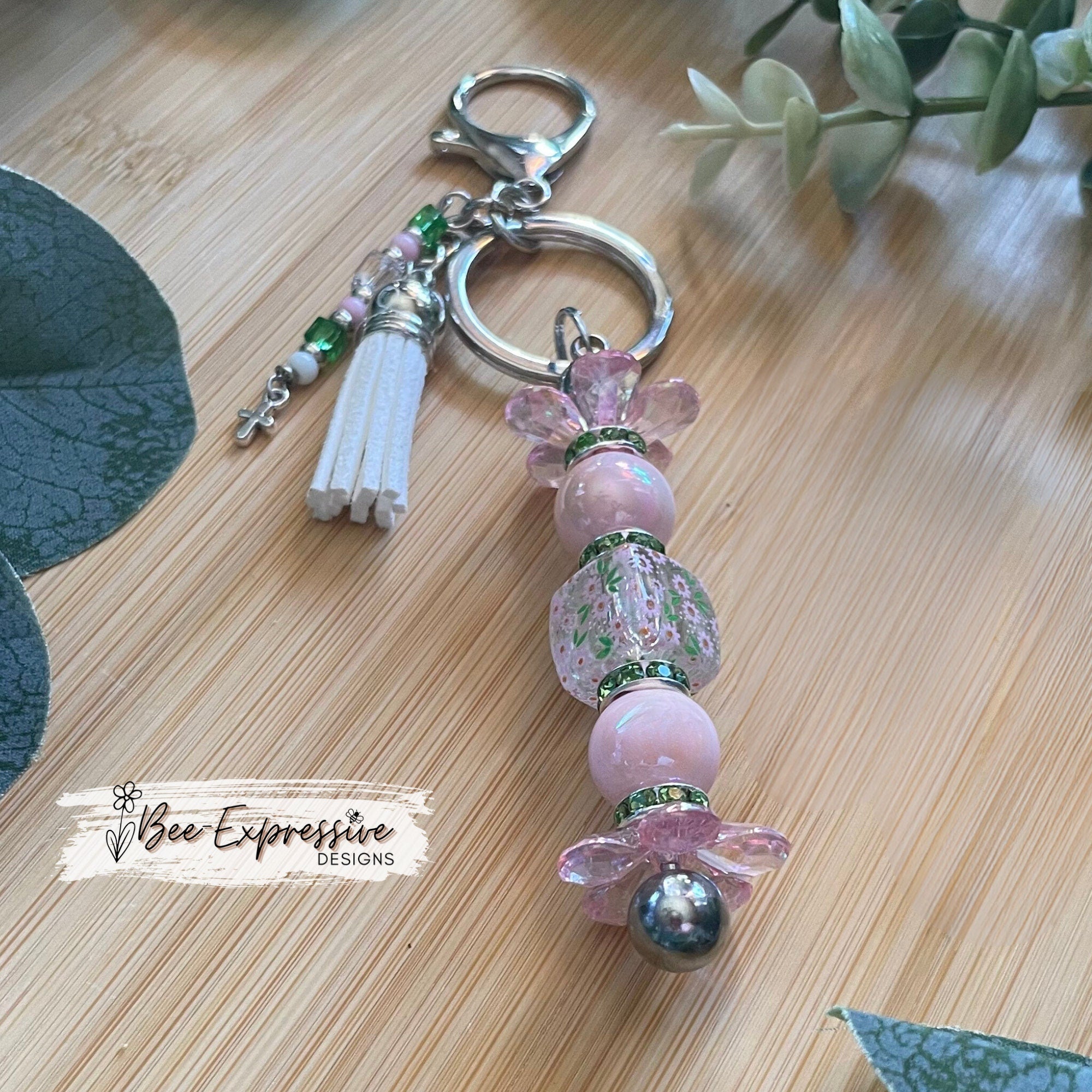 Beautiful, handmade keychain with iridescent pink & green beads! Lobster claw, alloy keychain, acrylic beads, beaded tassel with cross charm