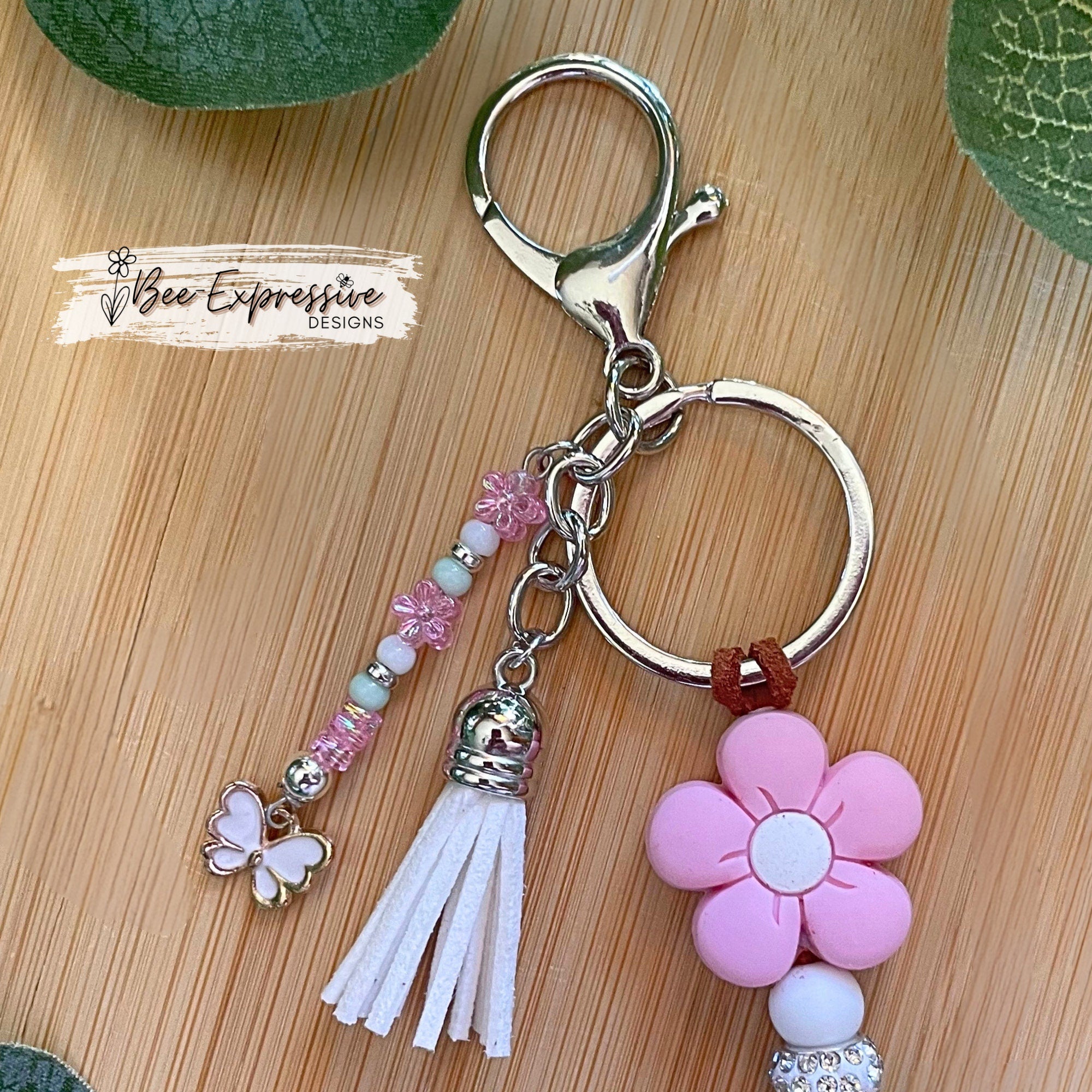 Handmade unique keychain with “Don’t look back” focal bead! Lobster clasp, suede cord, silicone beads, beaded tassel with butterfly charm