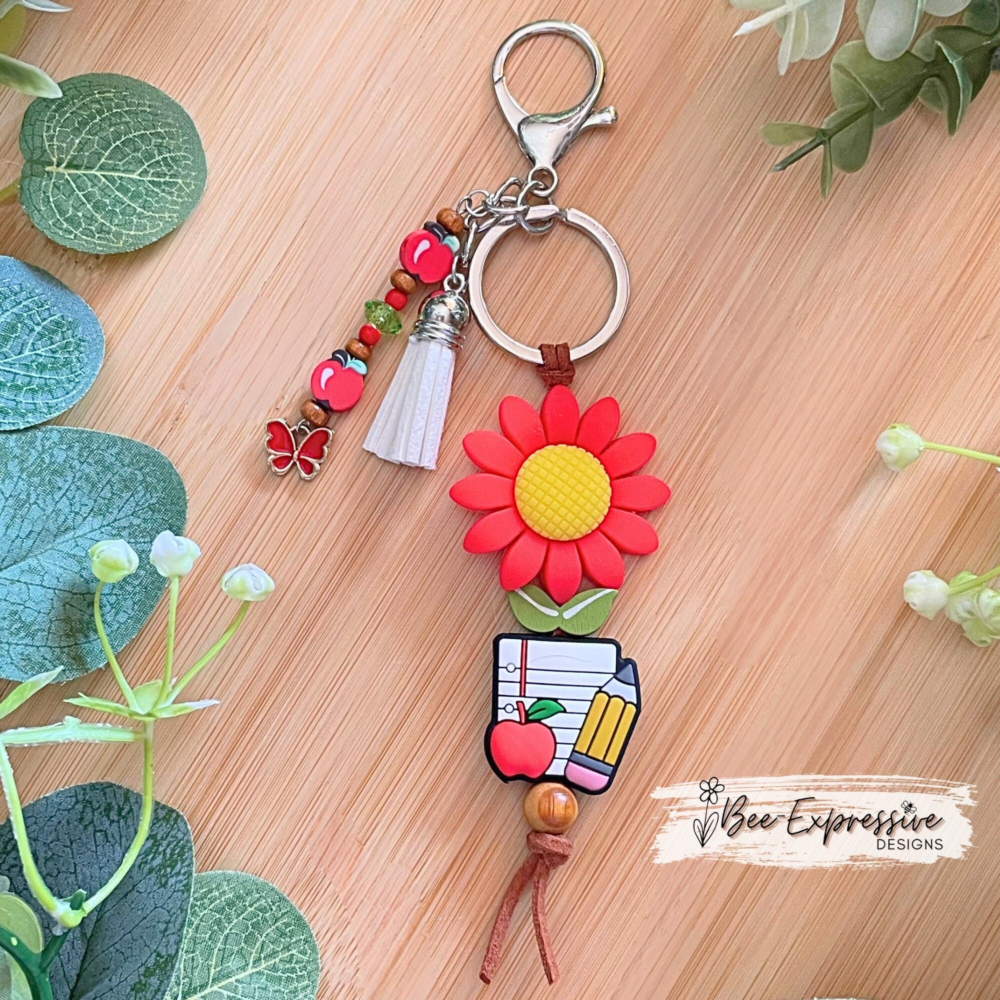 Handmade, cute, TEACHER keychain!  Lobster claw clasp, brown suede cord, daisy focal bead, beaded tassel, clay apple beads, butterfly charm