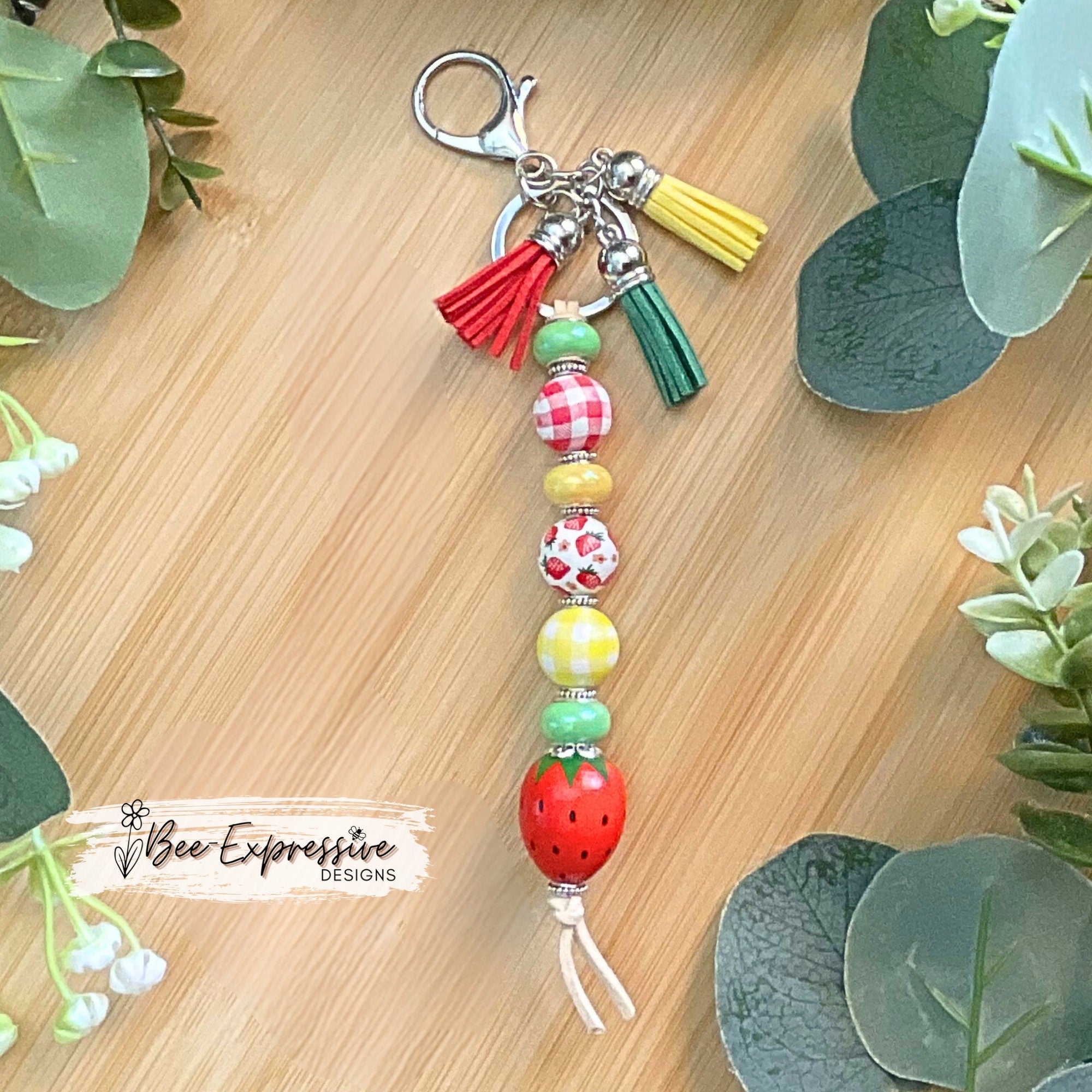 HANDMADE, unique, beaded strawberry keychain! Lobster clasp, suede cord, acrylic rondelle spacer beads, gingham beads, tassels, wood beads