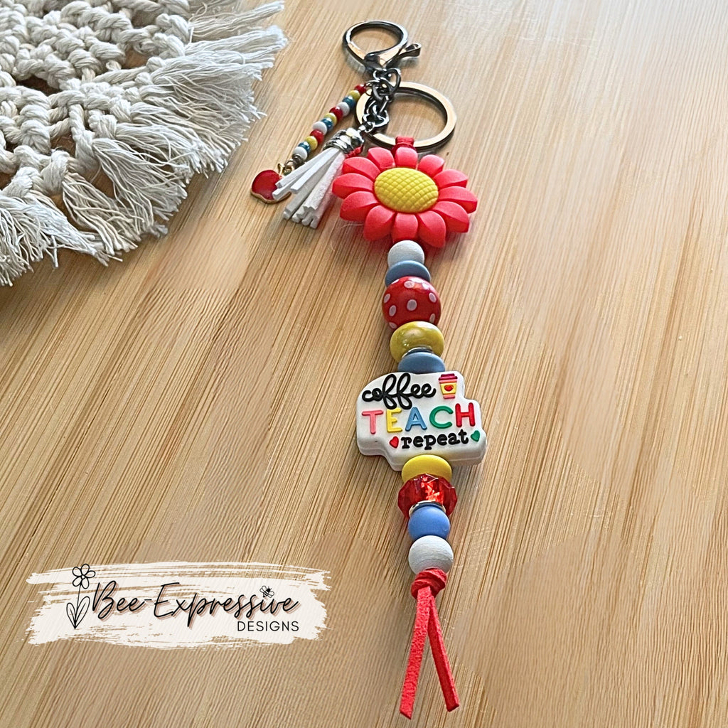 Handmade, cute, TEACHER keychain! Lobster or swivel clasp, red suede cord, daisy flower bead, beaded tassel with an apple charm pendant