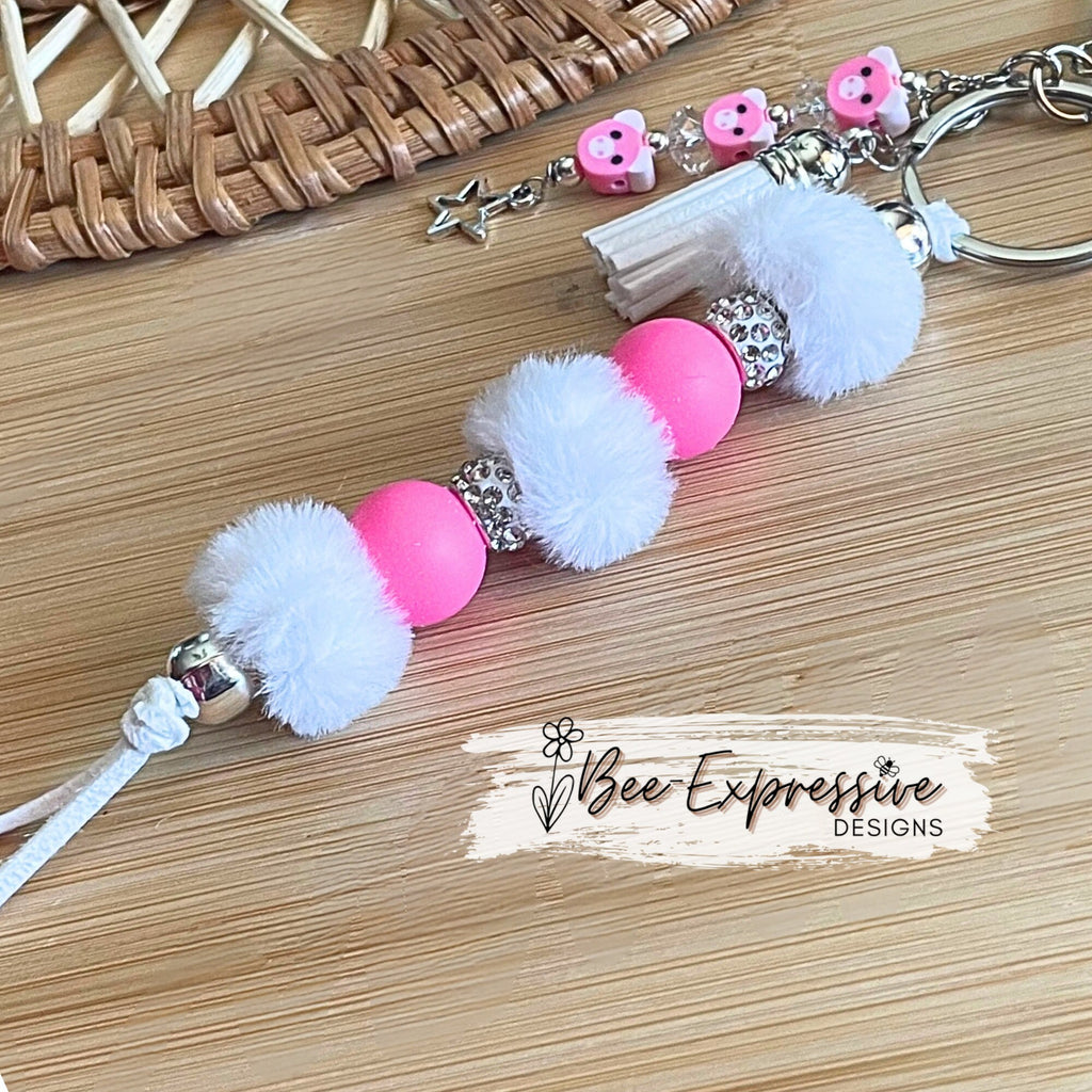 Adorable, handmade, pig keychain! Lobster claw clasp, rhinestones, hot pink round silicone beads, furry beads and a pig beaded tassel!