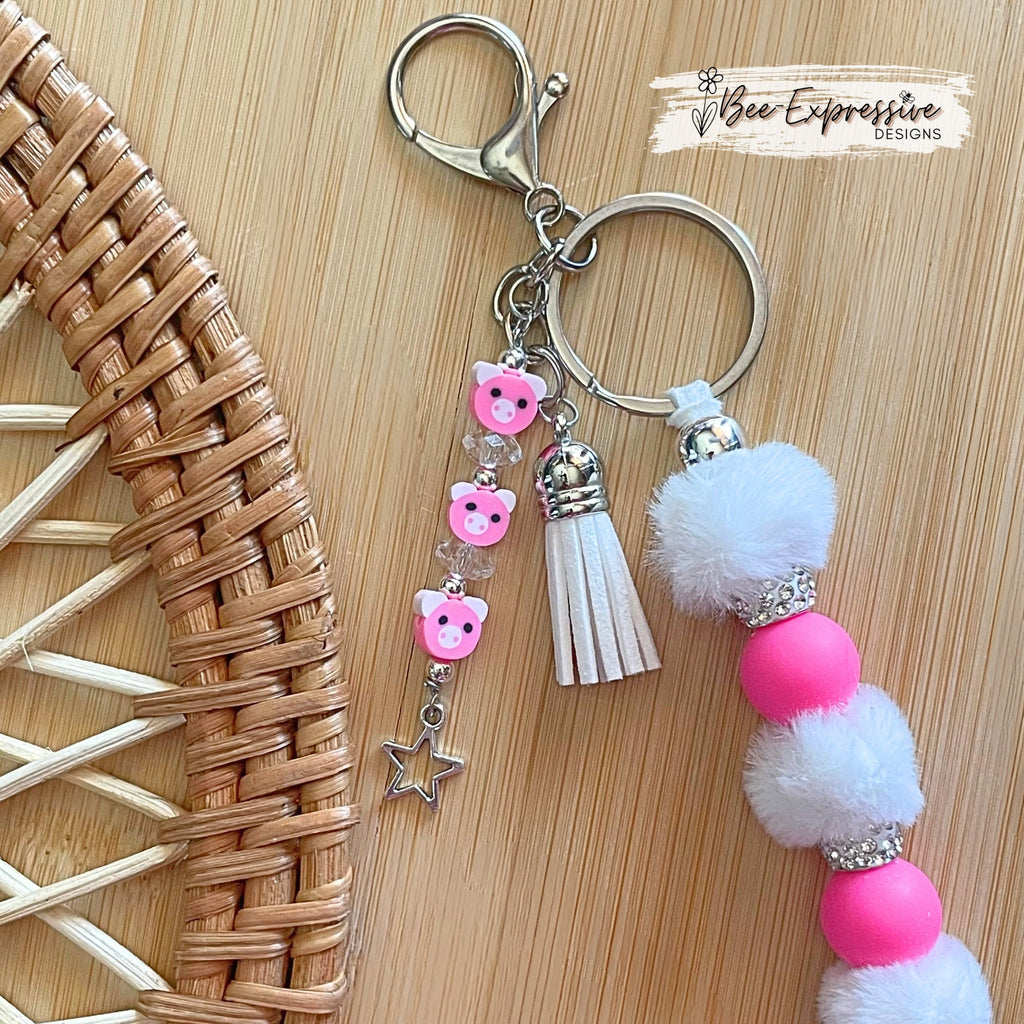 Adorable, handmade, pig keychain! Lobster claw clasp, rhinestones, hot pink round silicone beads, furry beads and a pig beaded tassel!