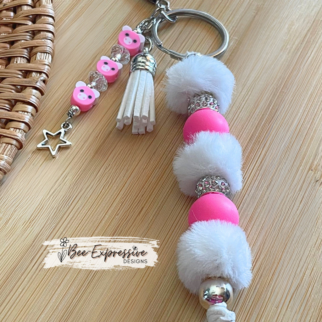 Adorable, handmade, pig keychain! Lobster claw clasp, rhinestones, hot pink round silicone beads, furry beads and a pig beaded tassel!