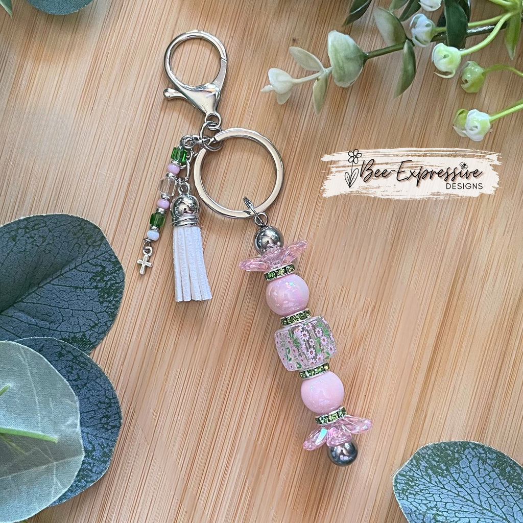 Beautiful, handmade keychain with iridescent pink & green beads! Lobster claw, alloy keychain, acrylic beads, beaded tassel with cross charm