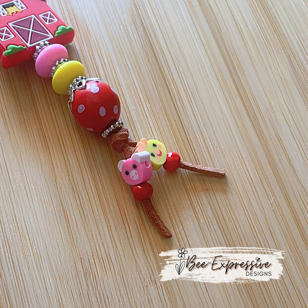 Handmade, vividly colored, silicone red barn keychain! Lobster clasp on suede cord, beaded tassel, pig & chicken clay beads!