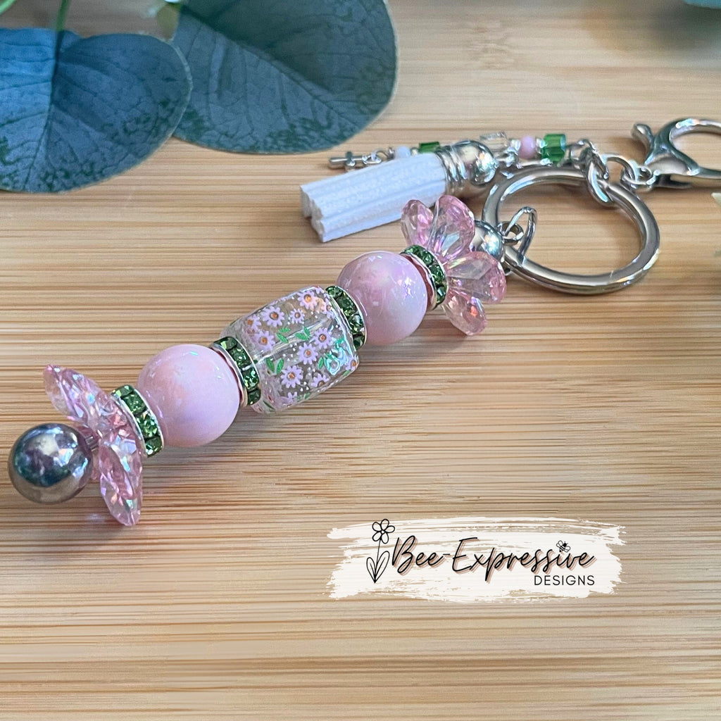 Beautiful, handmade keychain with iridescent pink & green beads! Lobster claw, alloy keychain, acrylic beads, beaded tassel with cross charm