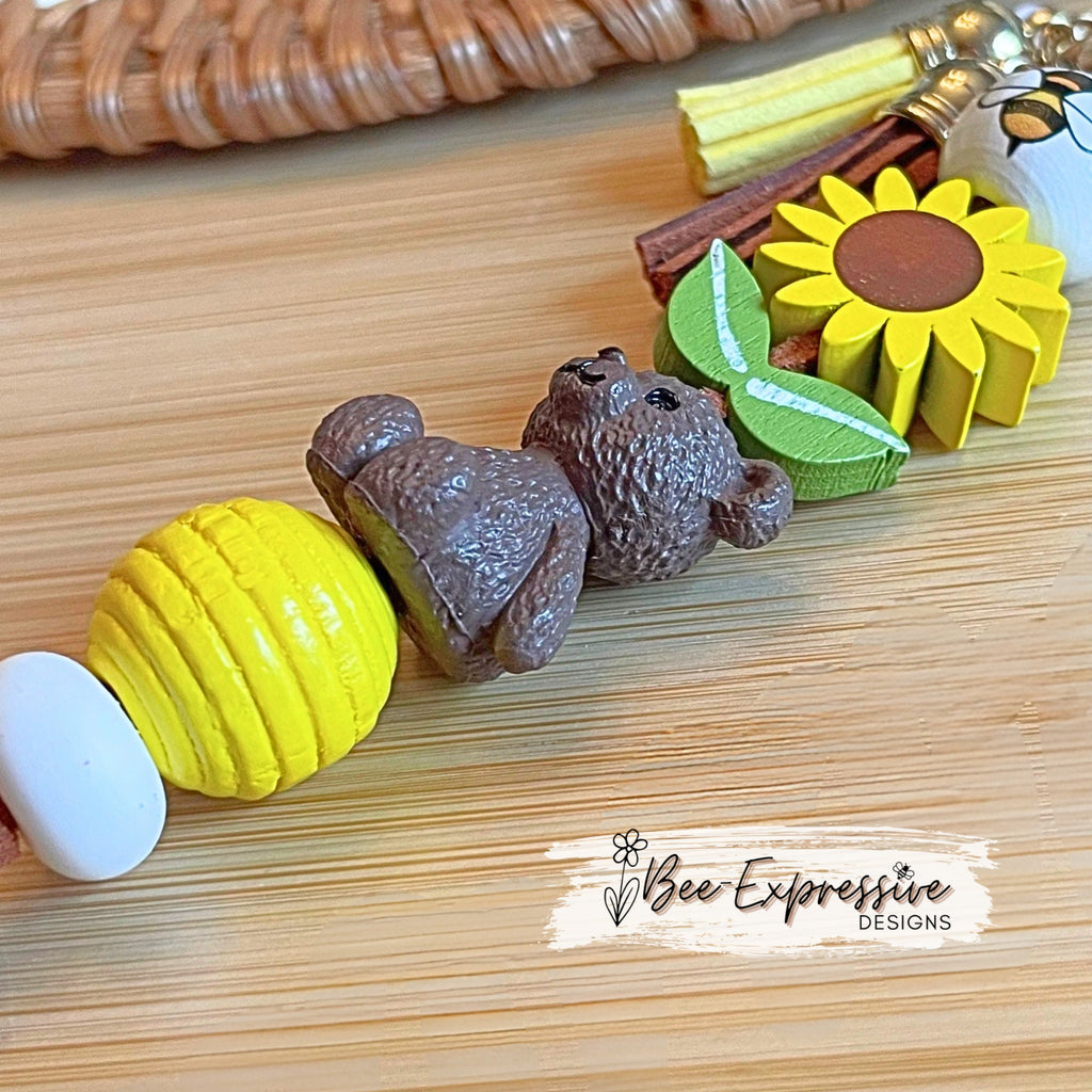 Handmade, adorable, honey bear bumble bee keychain! Lobster claw, corded, wood sunflower, bee bead, daisy charm pendant, tassels