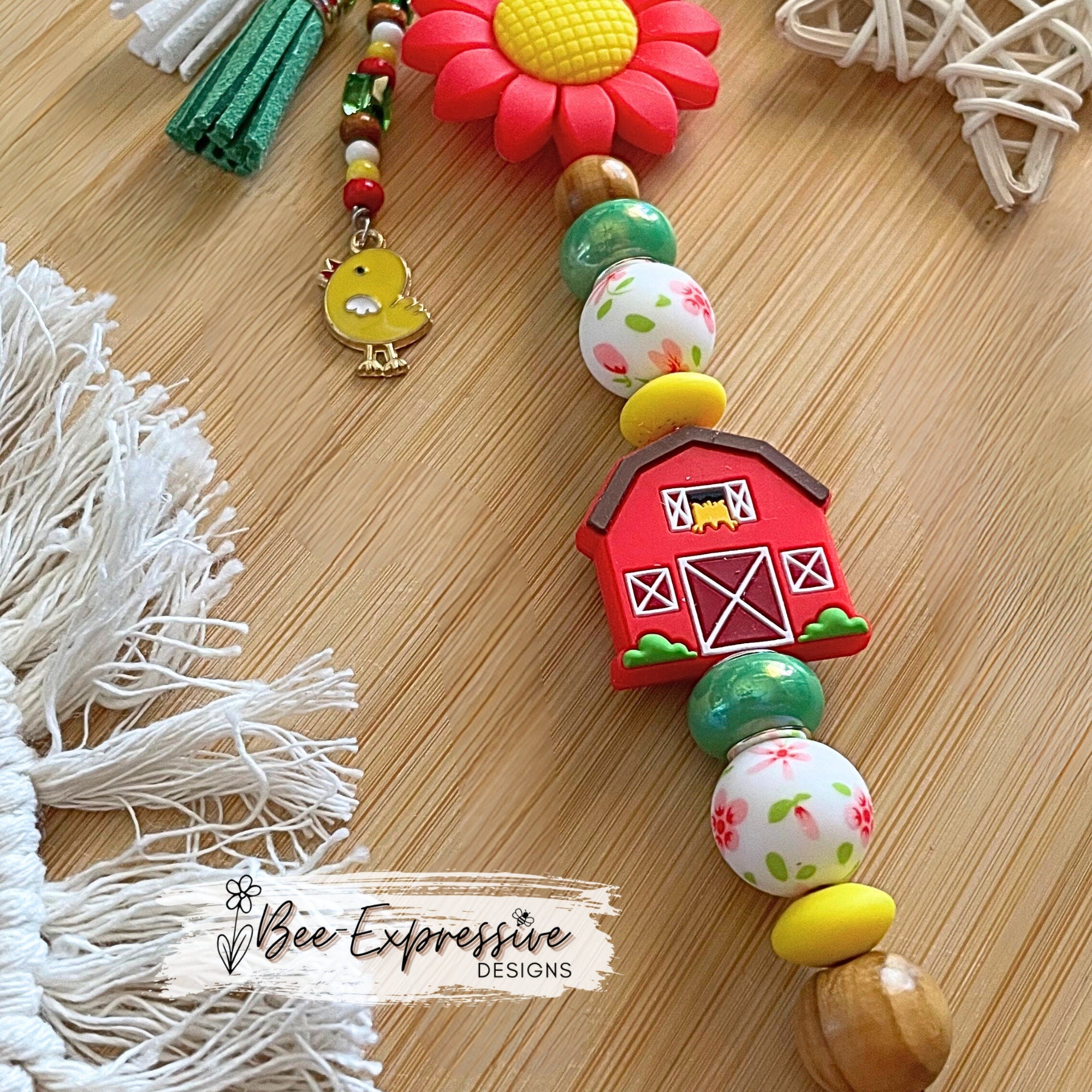 Handmade, vividly colored, silicone sunflower with barn keychain! Lobster clasp on suede cord, beaded tassel with chicken charm,