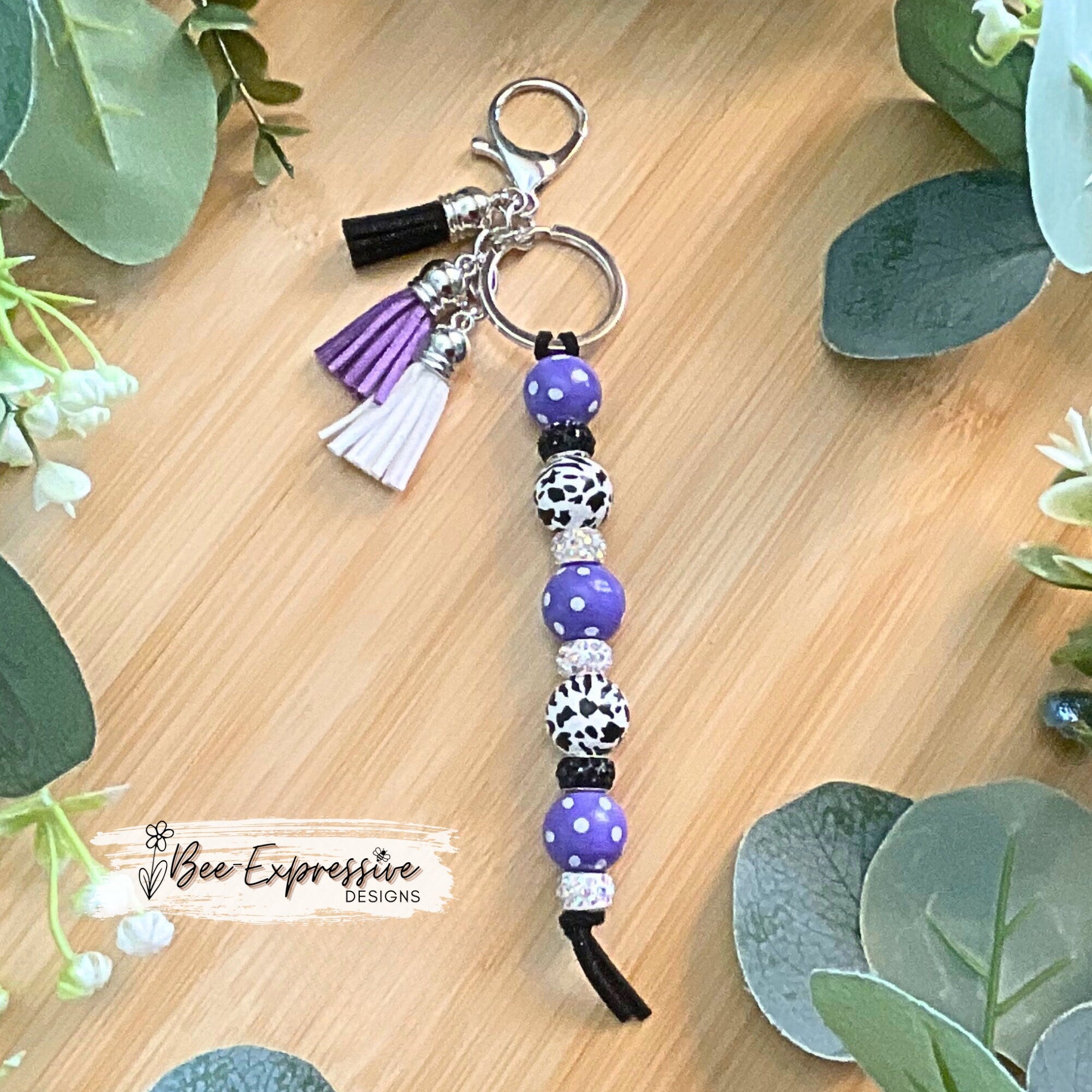 Beautiful, handmade and colorful, animal print keychain! Made with polka dot wood beads, lobster clasp, & three color coordinating tassels!
