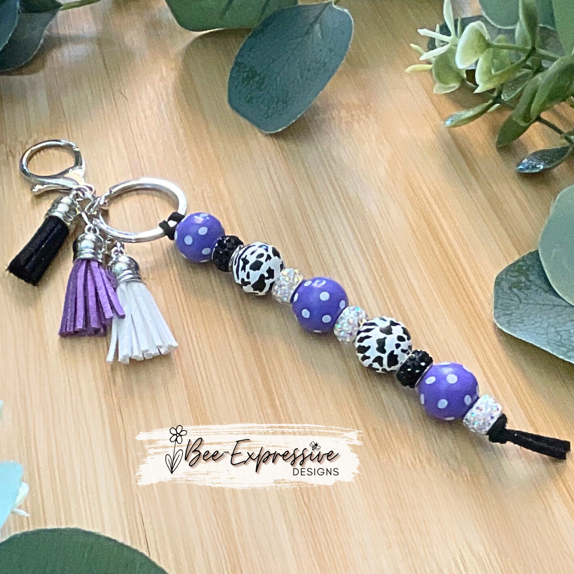 Beautiful, handmade and colorful, animal print keychain! Made with polka dot wood beads, lobster clasp, & three color coordinating tassels!
