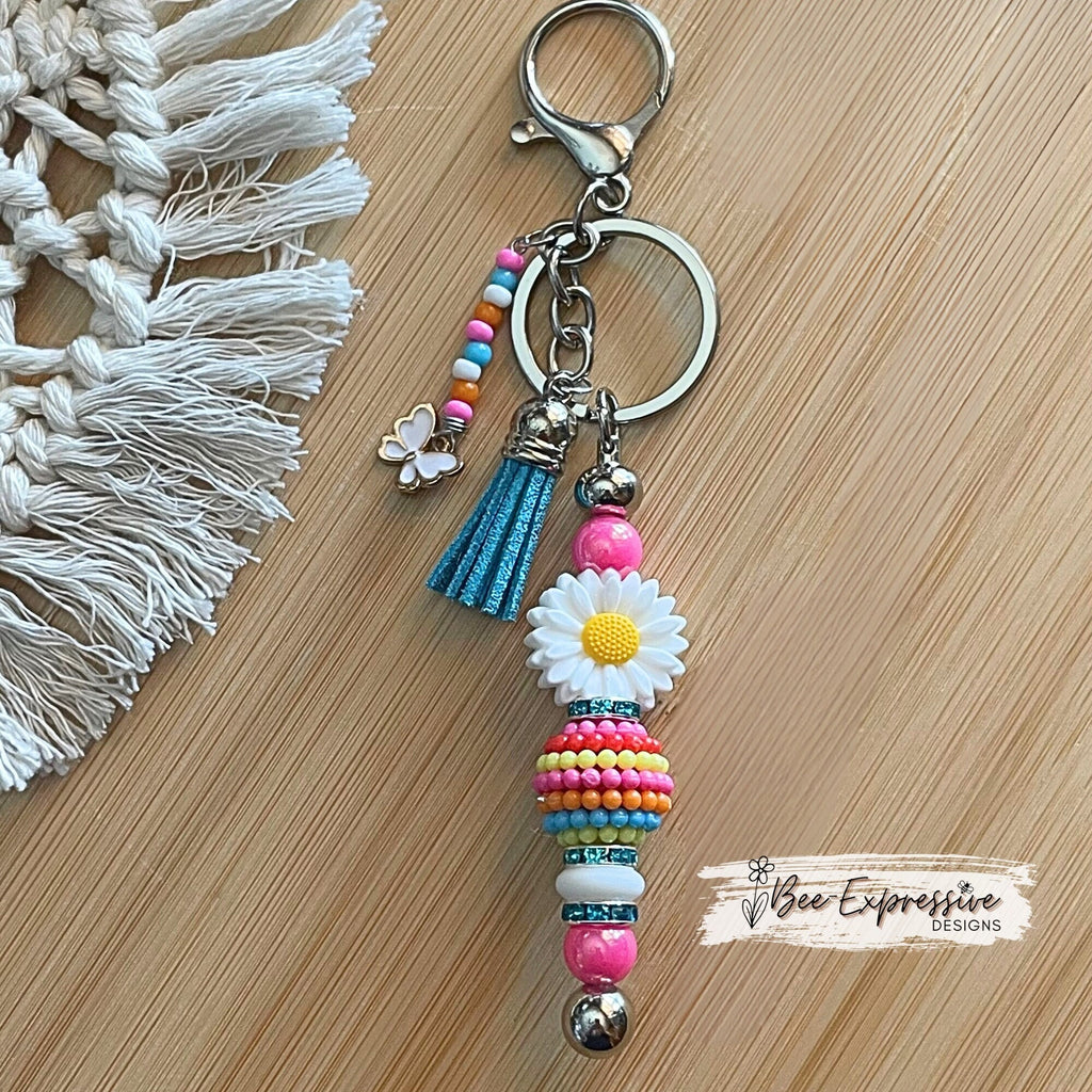 Beaded, white daisy keychain! Lobster or swivel clasp, rhinestones spacers, pink iridescent beads, bayberry bead, white butterfly charm!