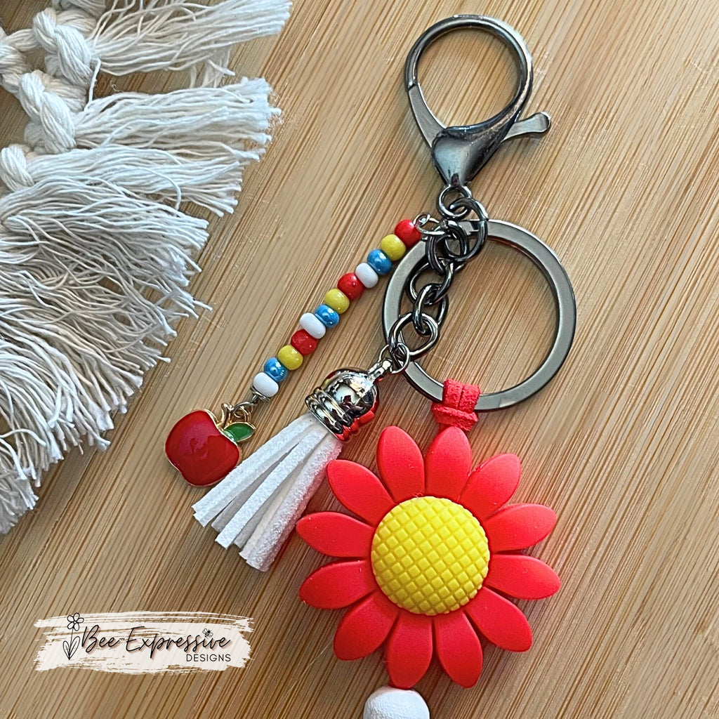 Handmade, cute, TEACHER keychain! Lobster or swivel clasp, red suede cord, daisy flower bead, beaded tassel with an apple charm pendant