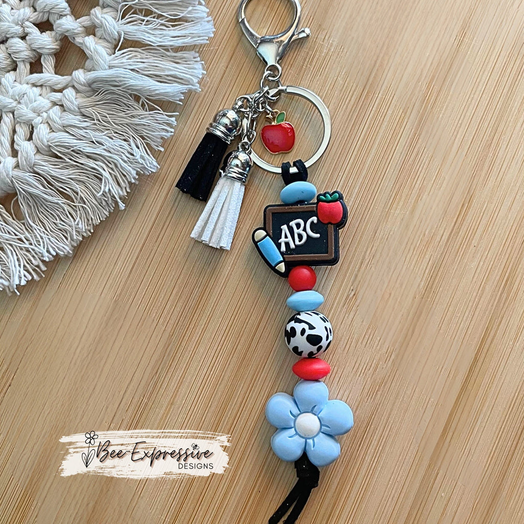 Handmade, cute, TEACHER keychain! Lobster claw clasp, black suede cord, silicone ABC chalkboard and daisy flower, an apple charm pendant!