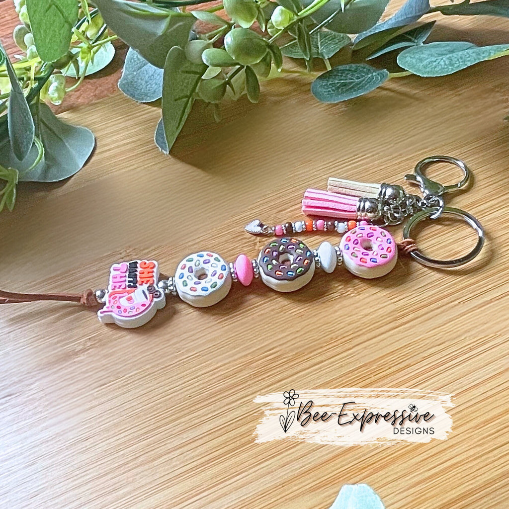 Handmade, DD donut inspired keychain! Lobster or swivel clasp, suede cord, silicone donut beads, beaded tassel with a heart charm!