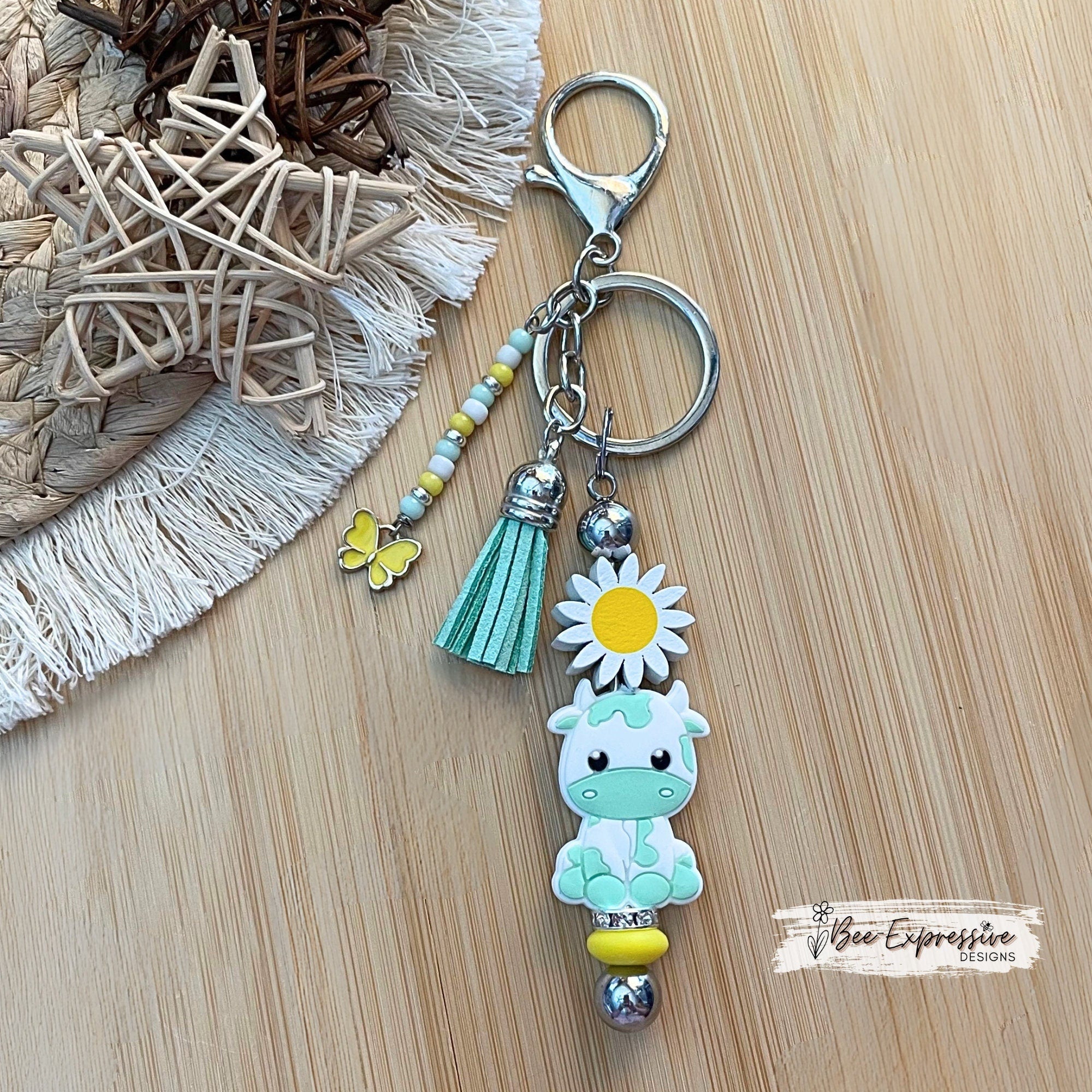 Handmade Turquoise Cow Keychain: Beaded Tassel with Butterfly Charm