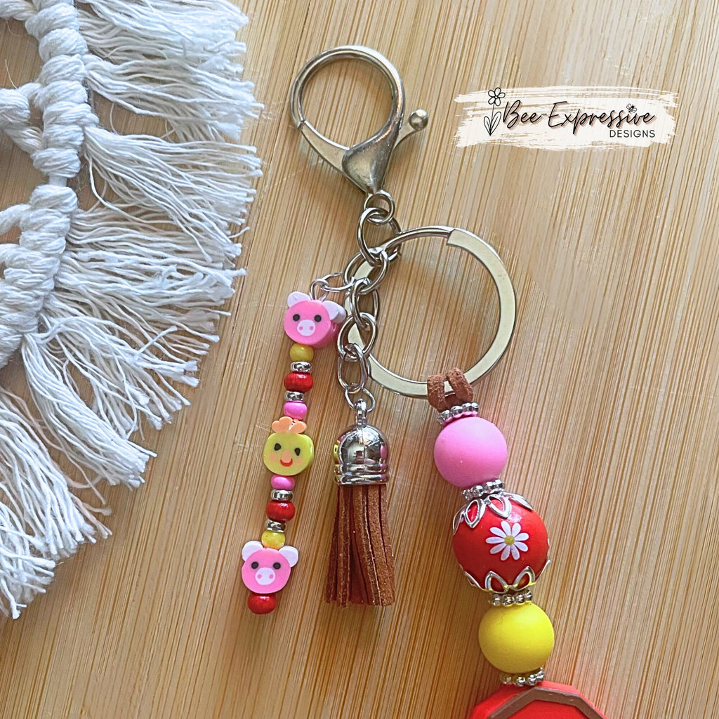 Handmade, vividly colored, silicone red barn keychain! Lobster clasp on suede cord, beaded tassel, pig & chicken clay beads!