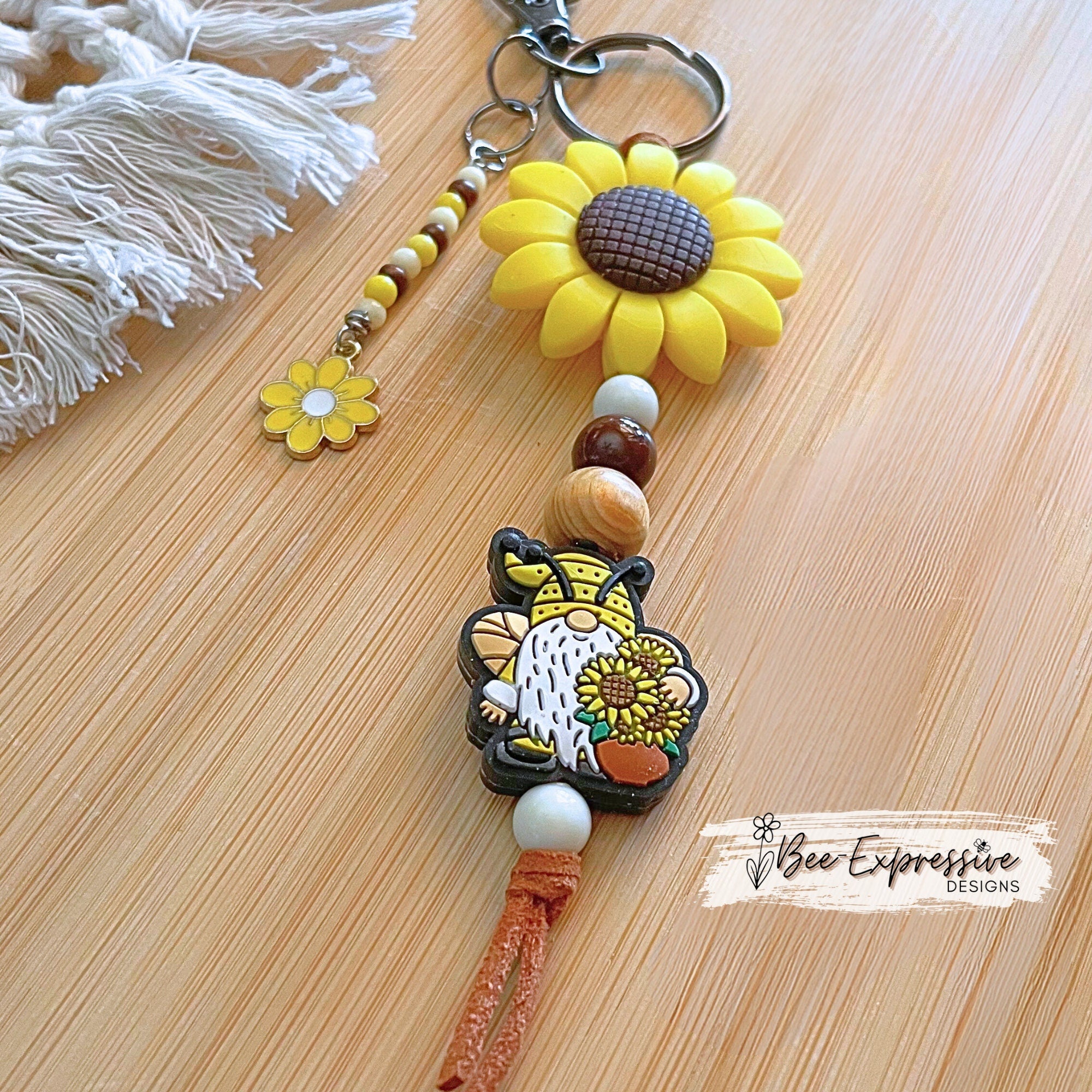 Handmade, unique, silicone sunflower gnome keychain!  Lobster clasp, suede cord, wood beads, beaded tassel with yellow daisy charm!